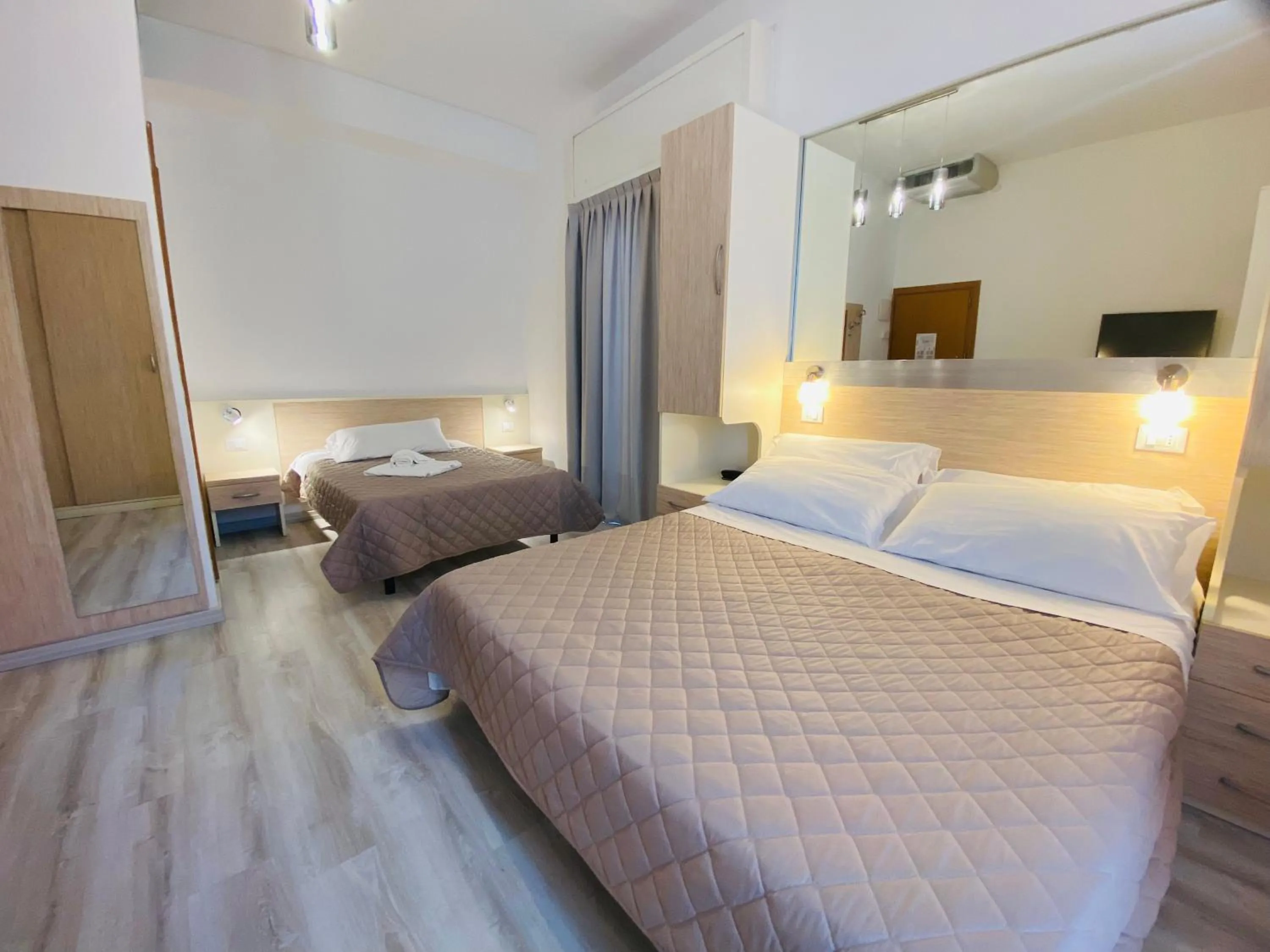 Bed in Hotel Butterfly Wellness & Spa