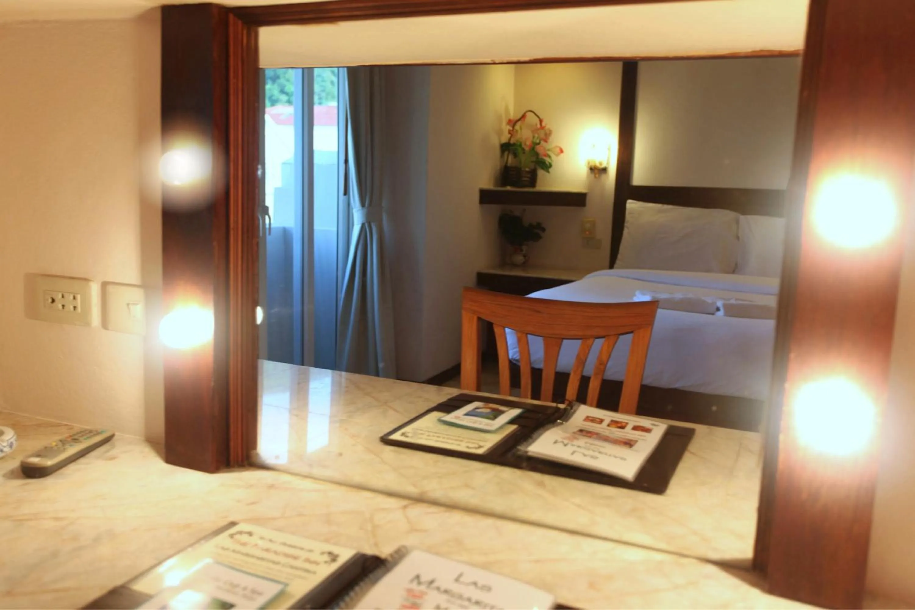 Seating area, Bed in Paradise Inn