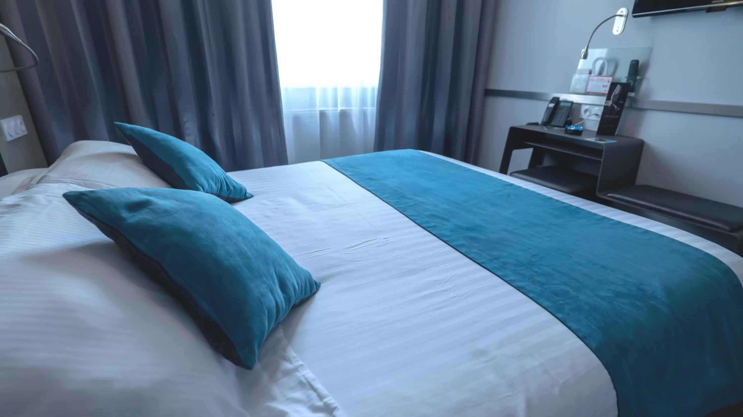 Bed in Hôtel d'Orléans