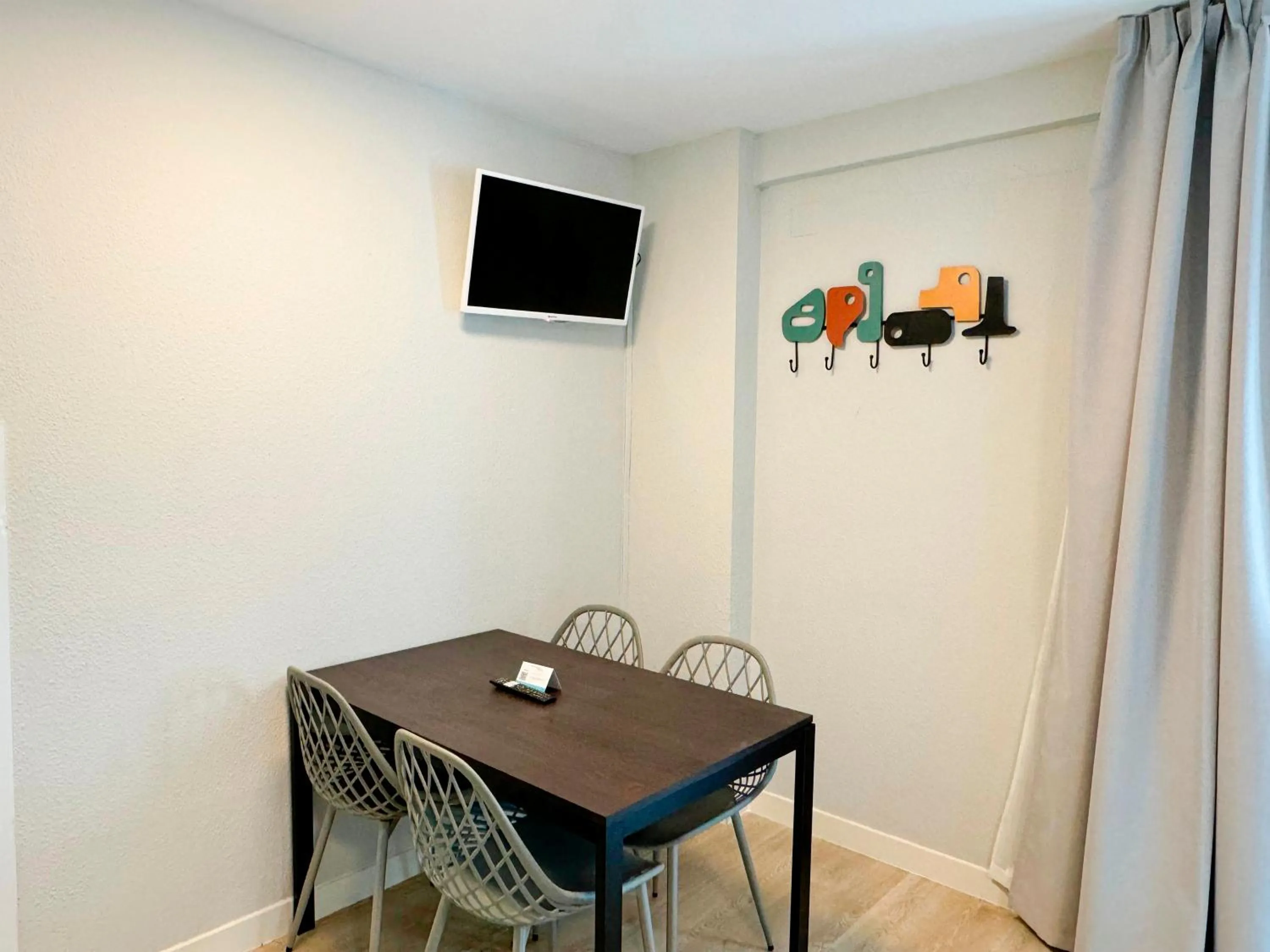 TV and multimedia in Apartamentos Midi 3000