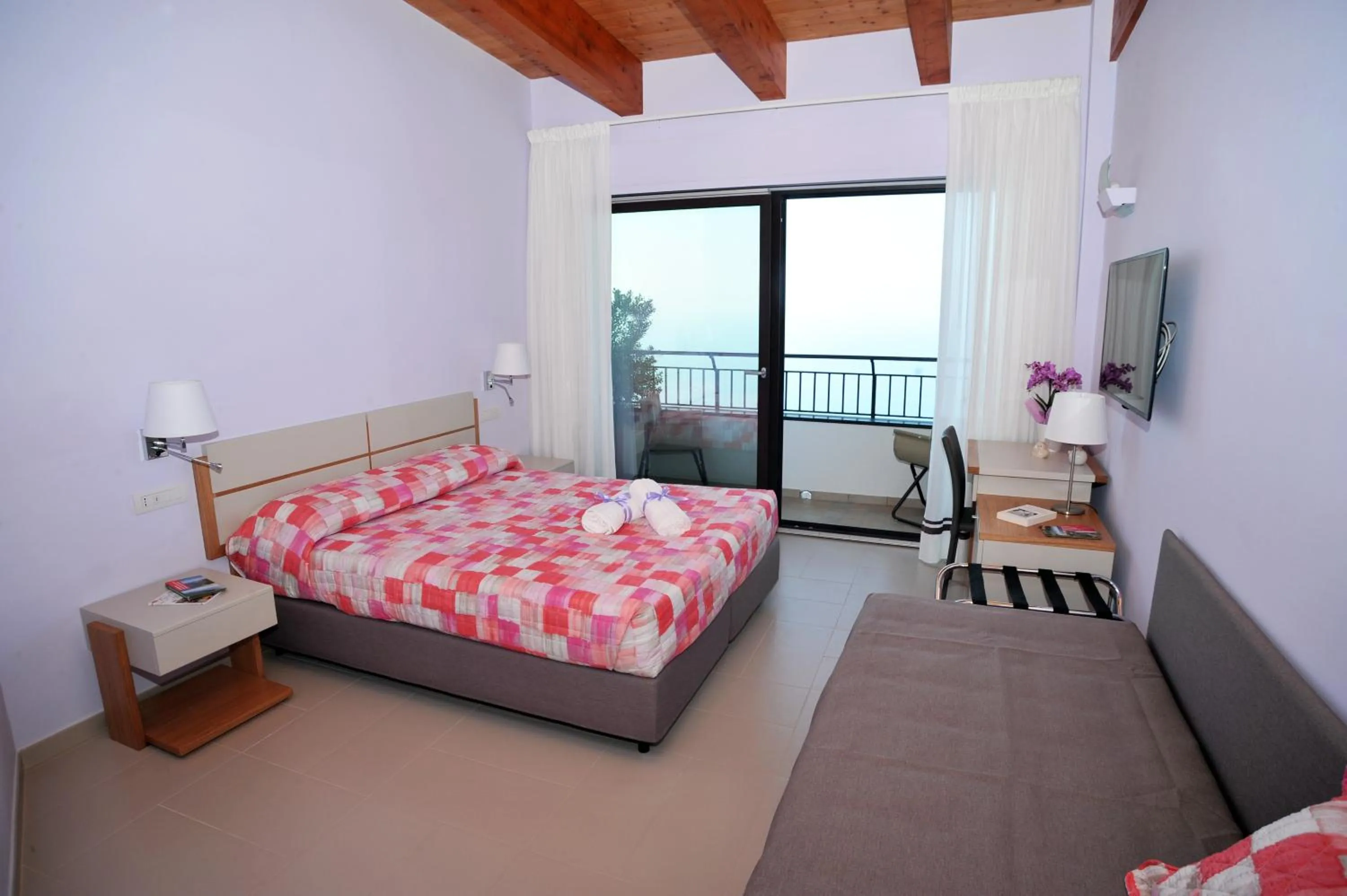 Bed in Villa Paradise Resort