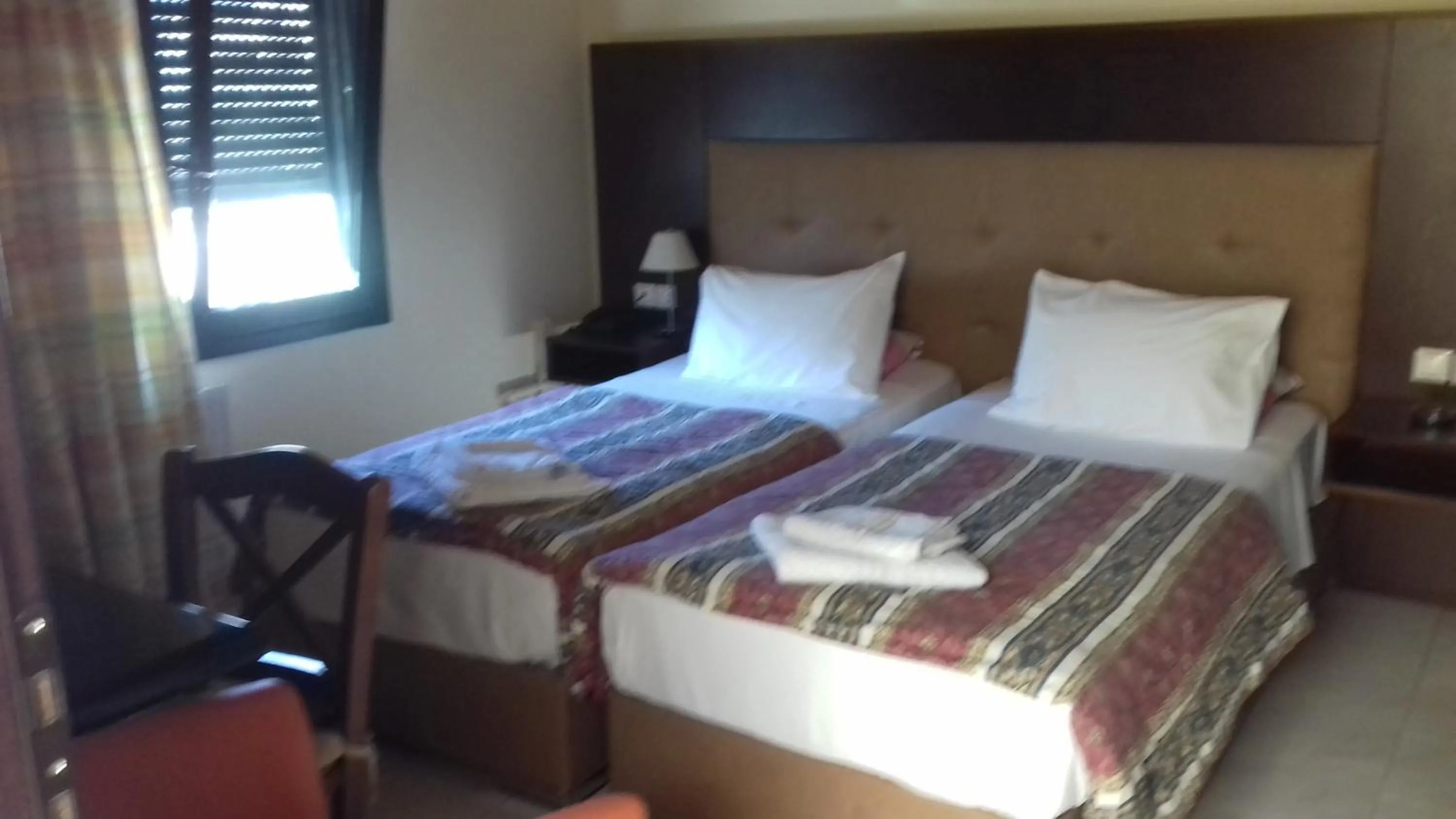 Bed in Parthenon Hotel