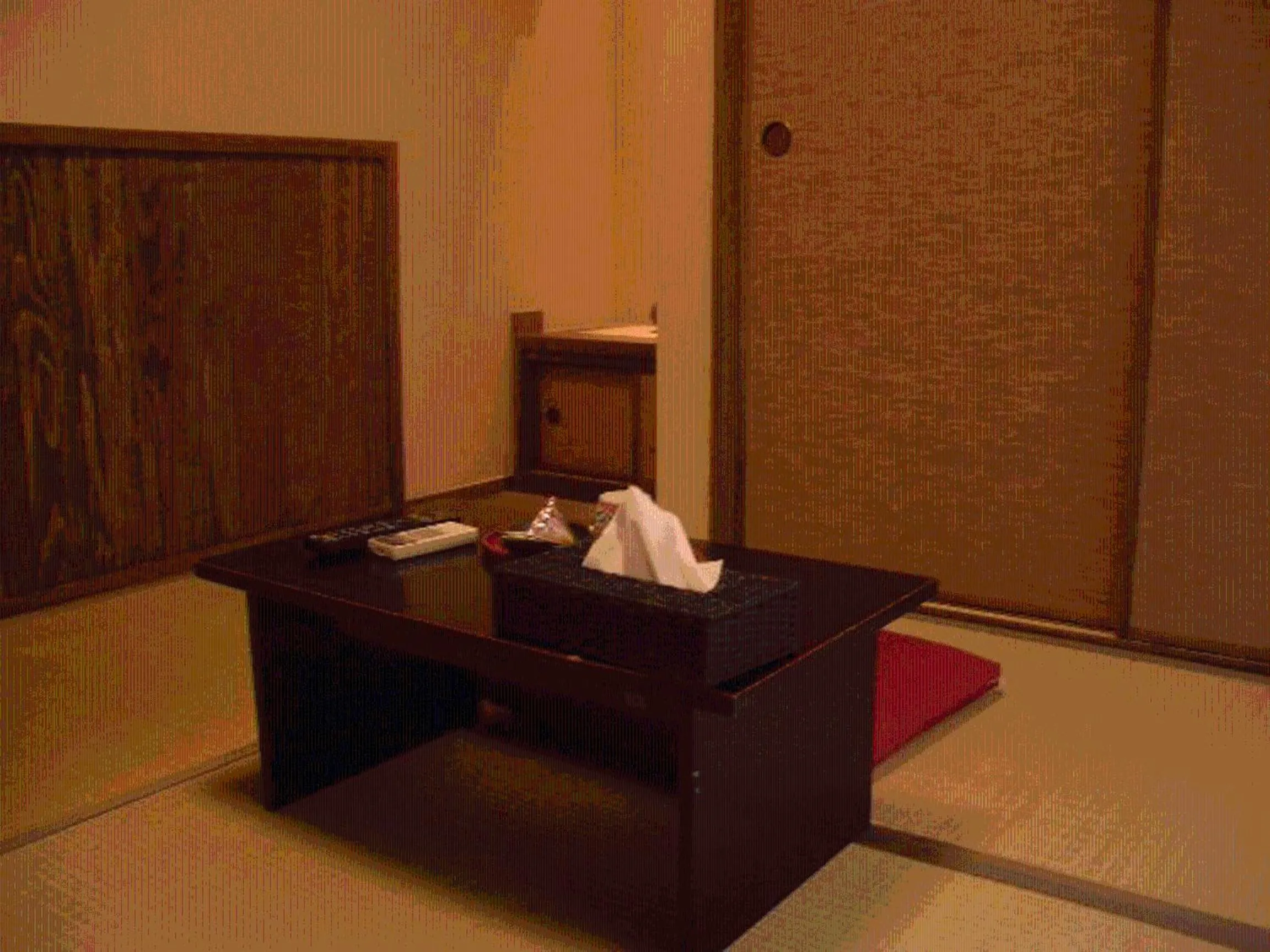 Seating area in Family Ryokan Kawakyu with Showa Retro, private hot spring