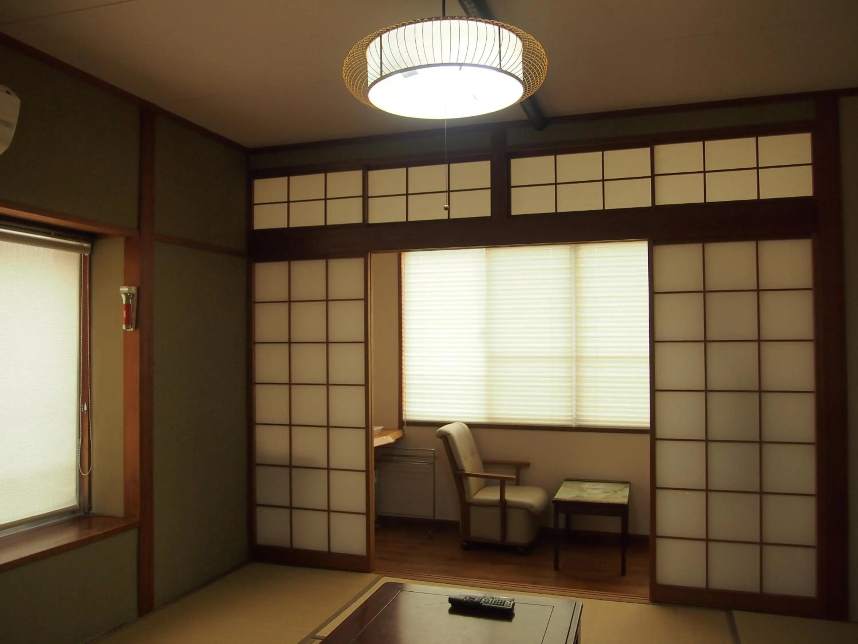 Seating area in Family Ryokan Kawakyu with Showa Retro, private hot spring