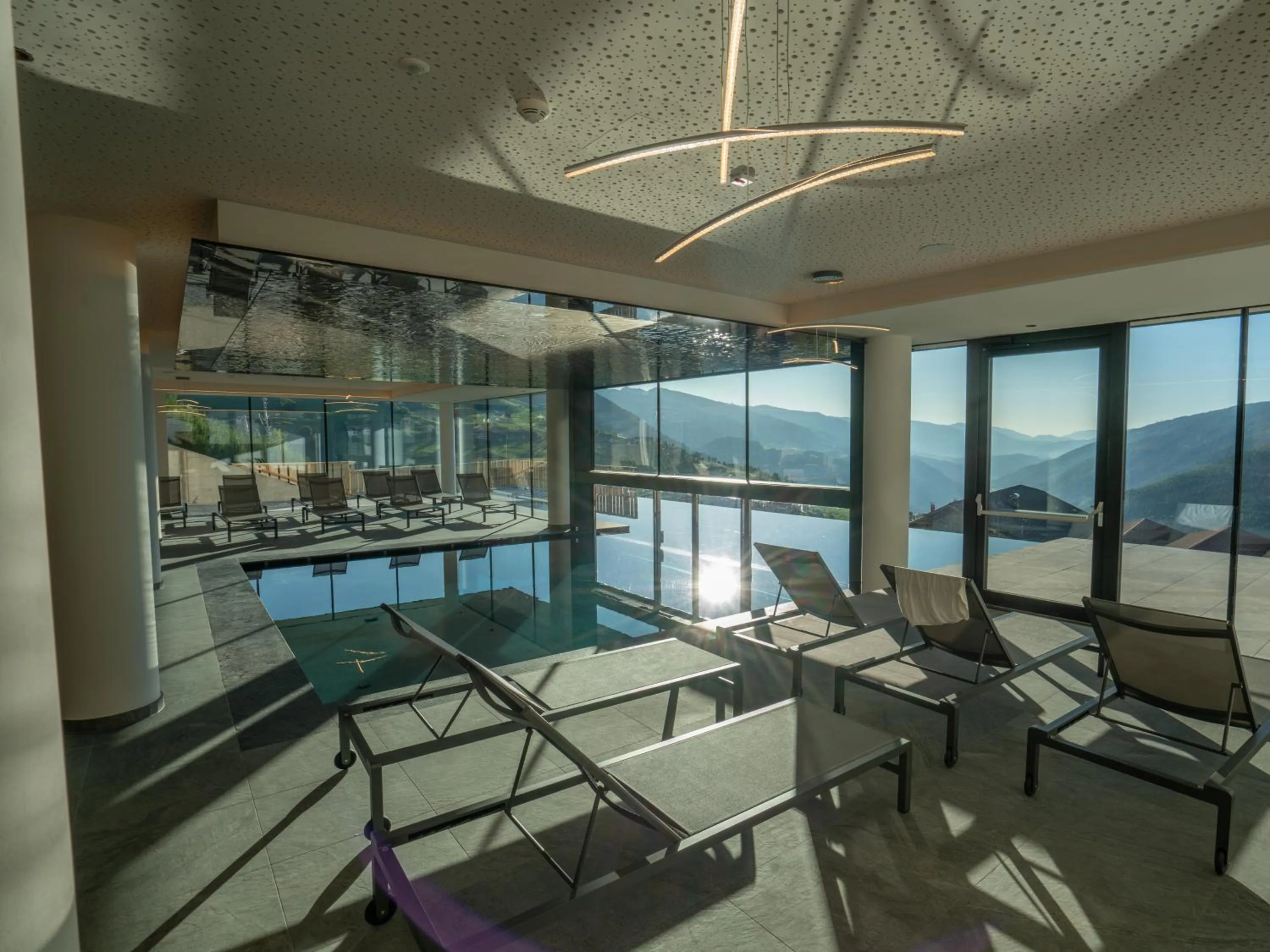 Swimming pool in Hotel Purvita by Oberlechner