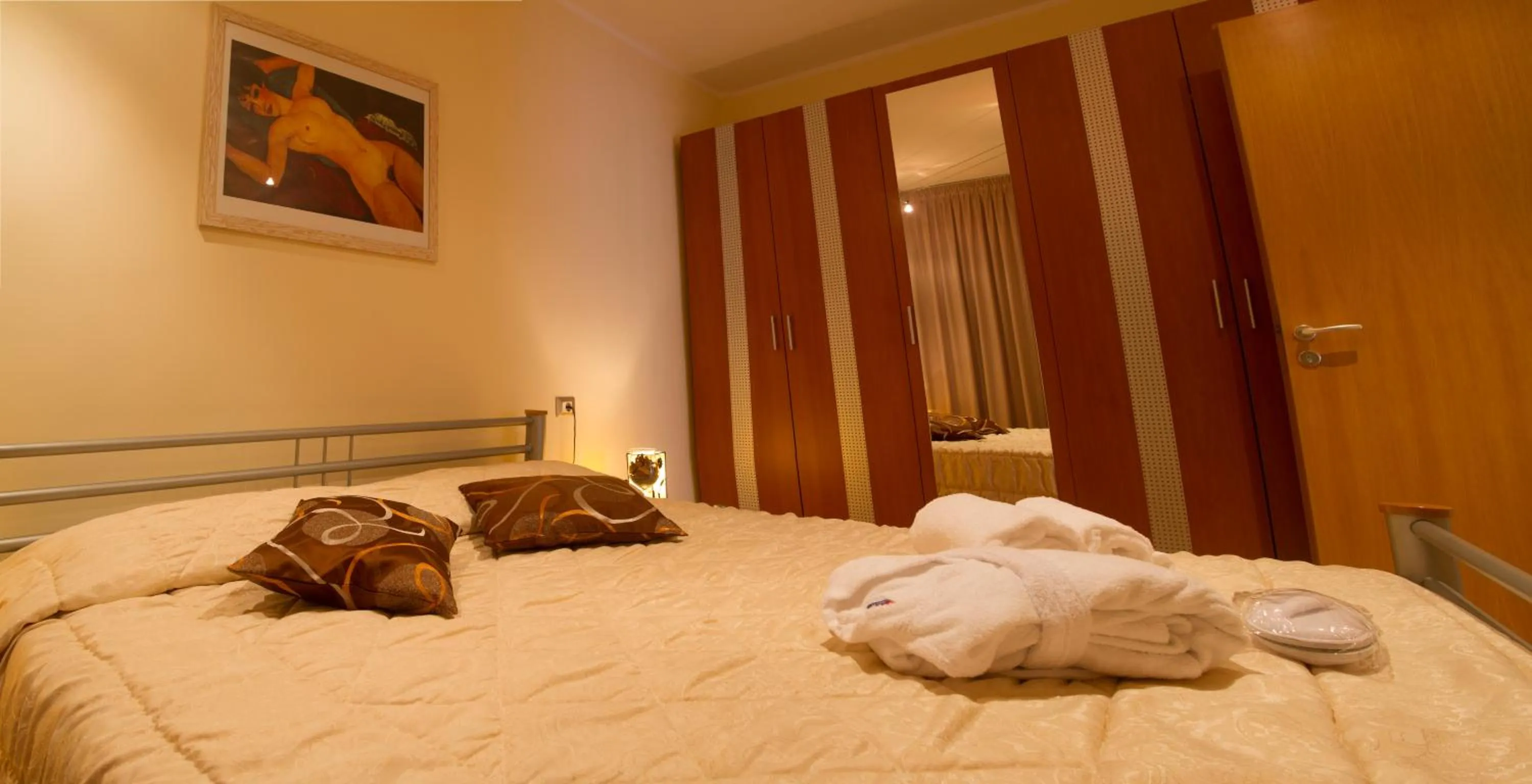 Bed in Prince Residence Apartments