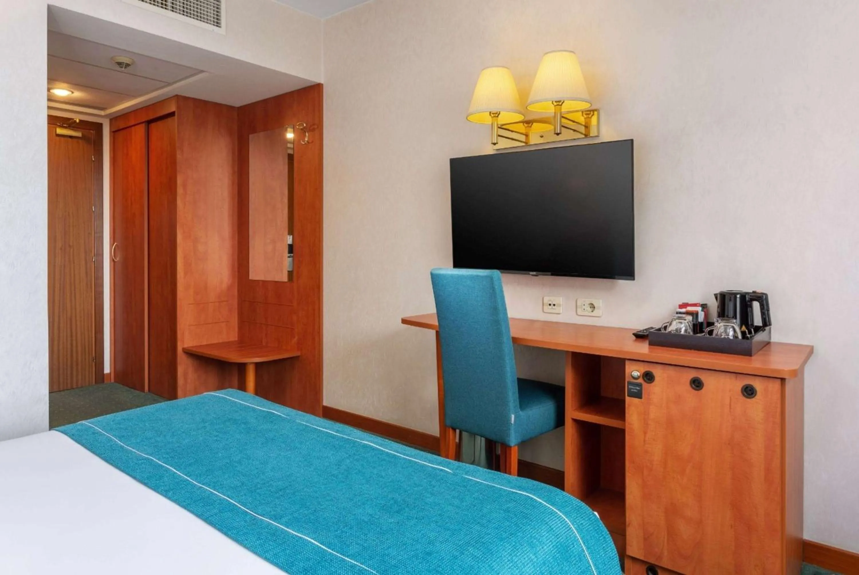 Bed in Ramada by Wyndham Bucharest Parc Hotel