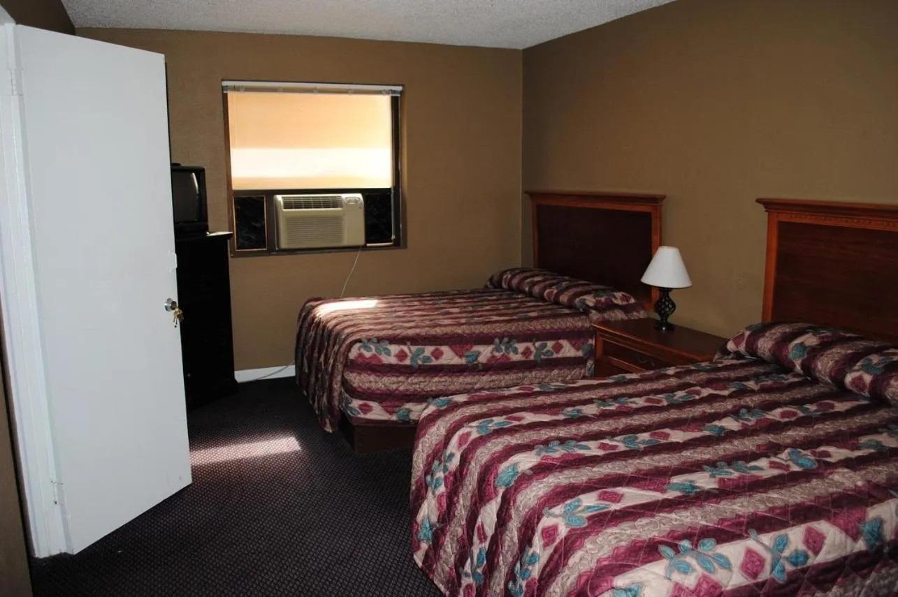 Bed in Atlantic Economy Inn