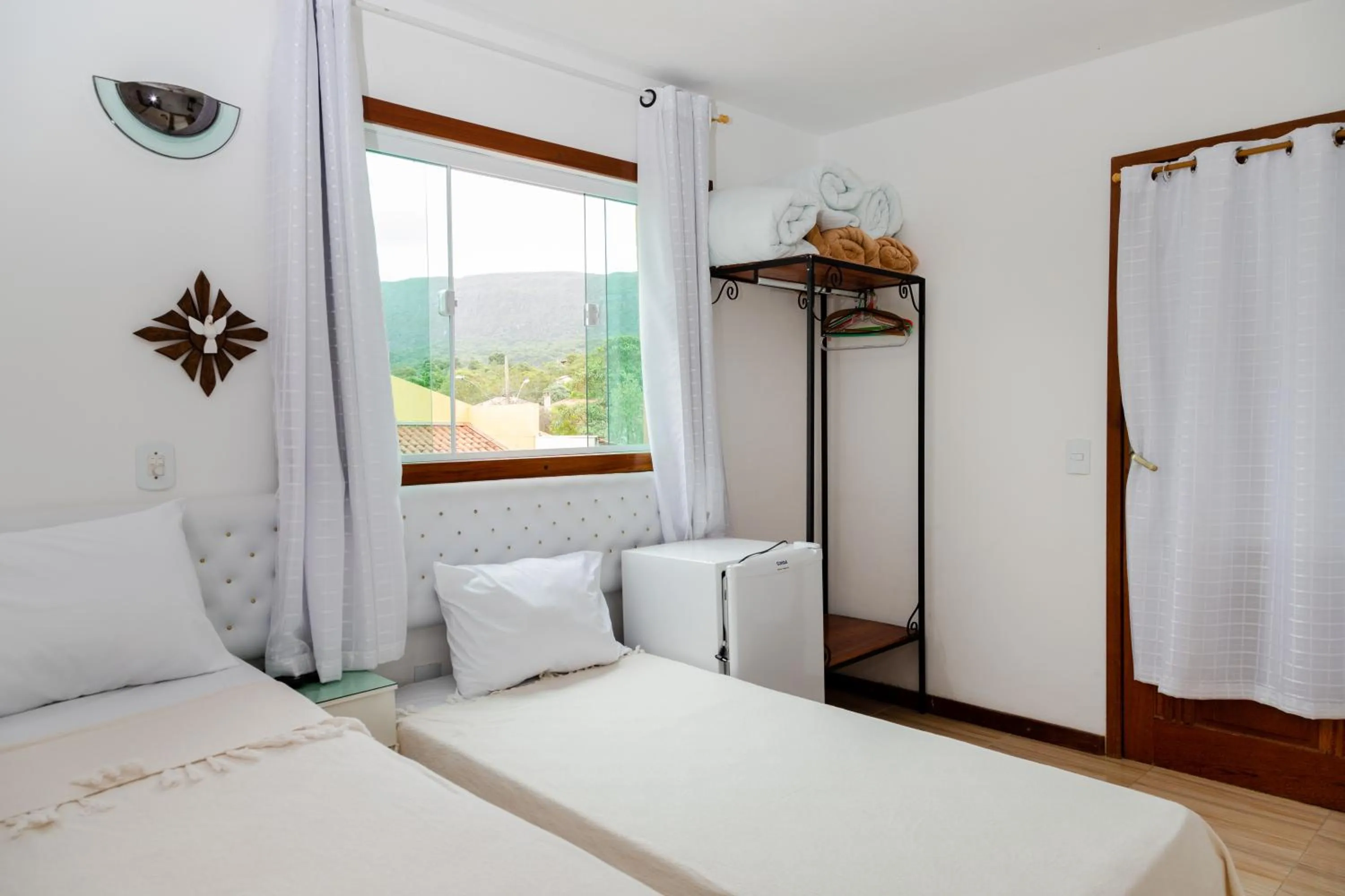 Bed in Pousada Brilho da Serra