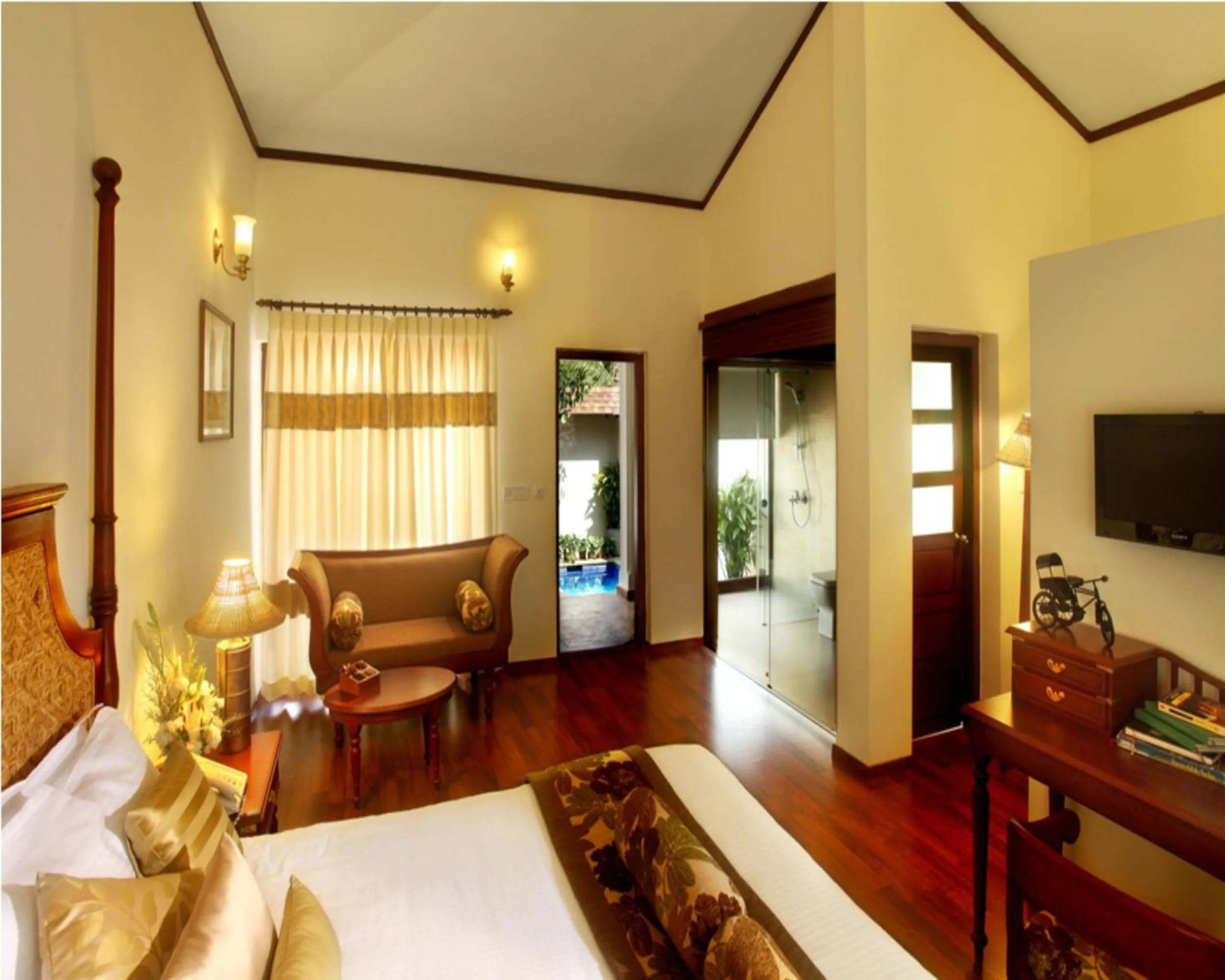 Bed in Carmelia Haven Resort Thekkady