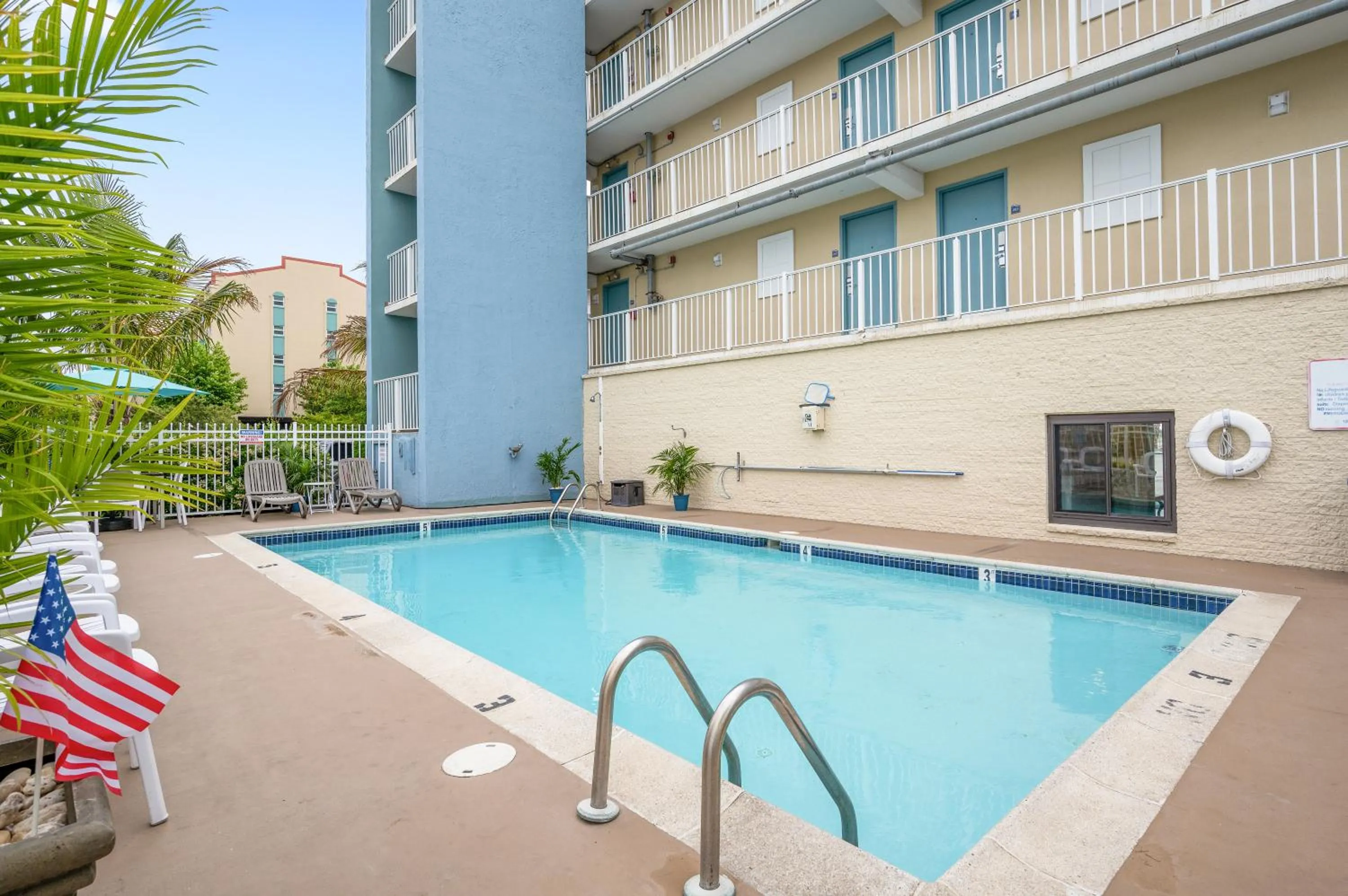 Swimming pool in Coastal Palms Inn and Suites