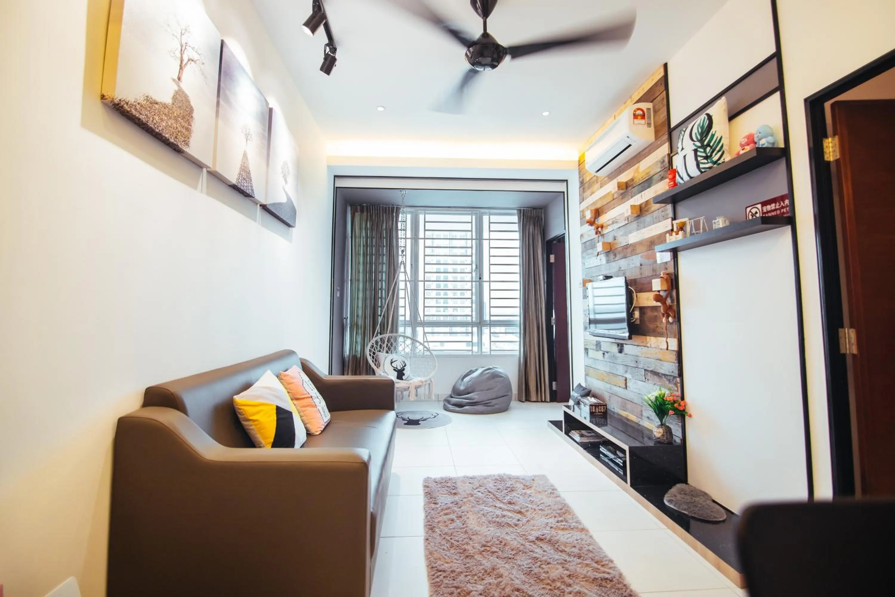 Living room, Bed in Akademik Suite by JK Home