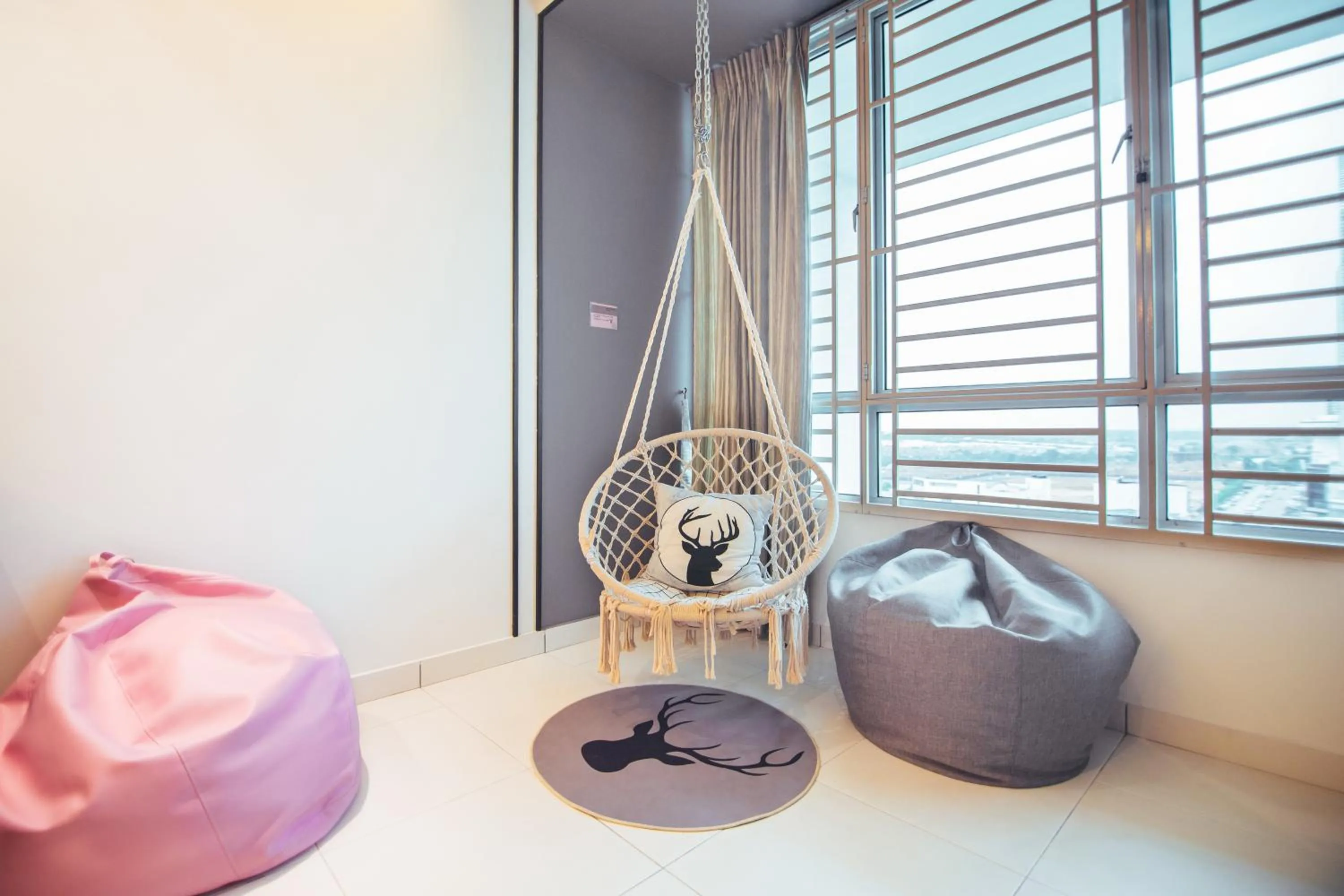 Seating area, Bed in Akademik Suite by JK Home