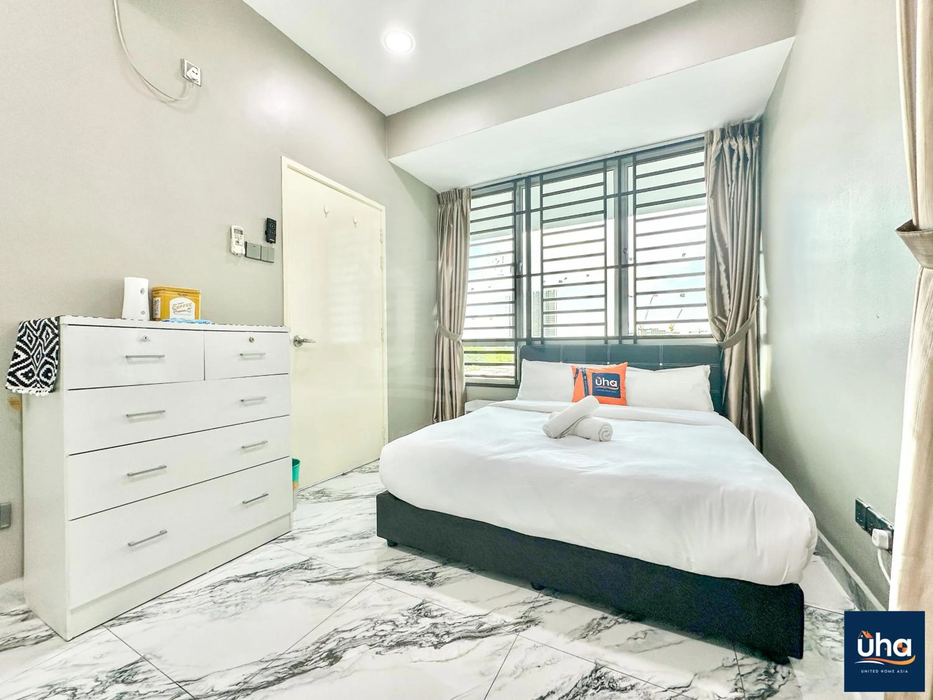 Bed in Akademik Suite by JK Home