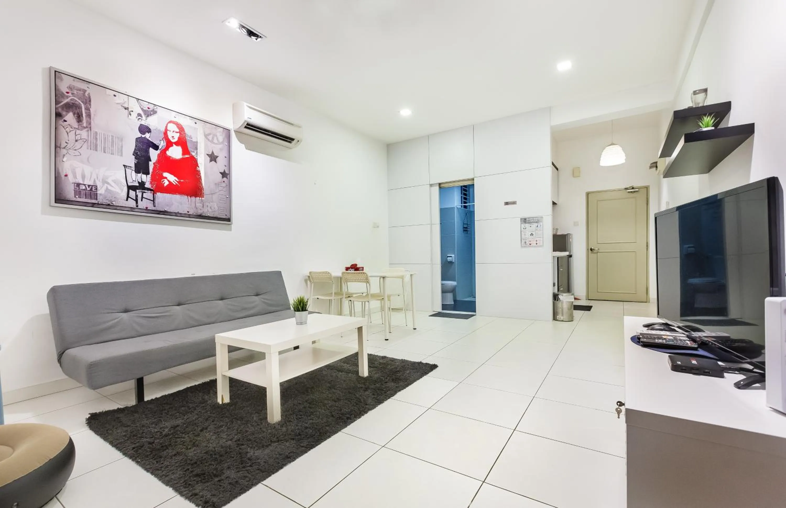 Living room in Akademik Suite by JK Home