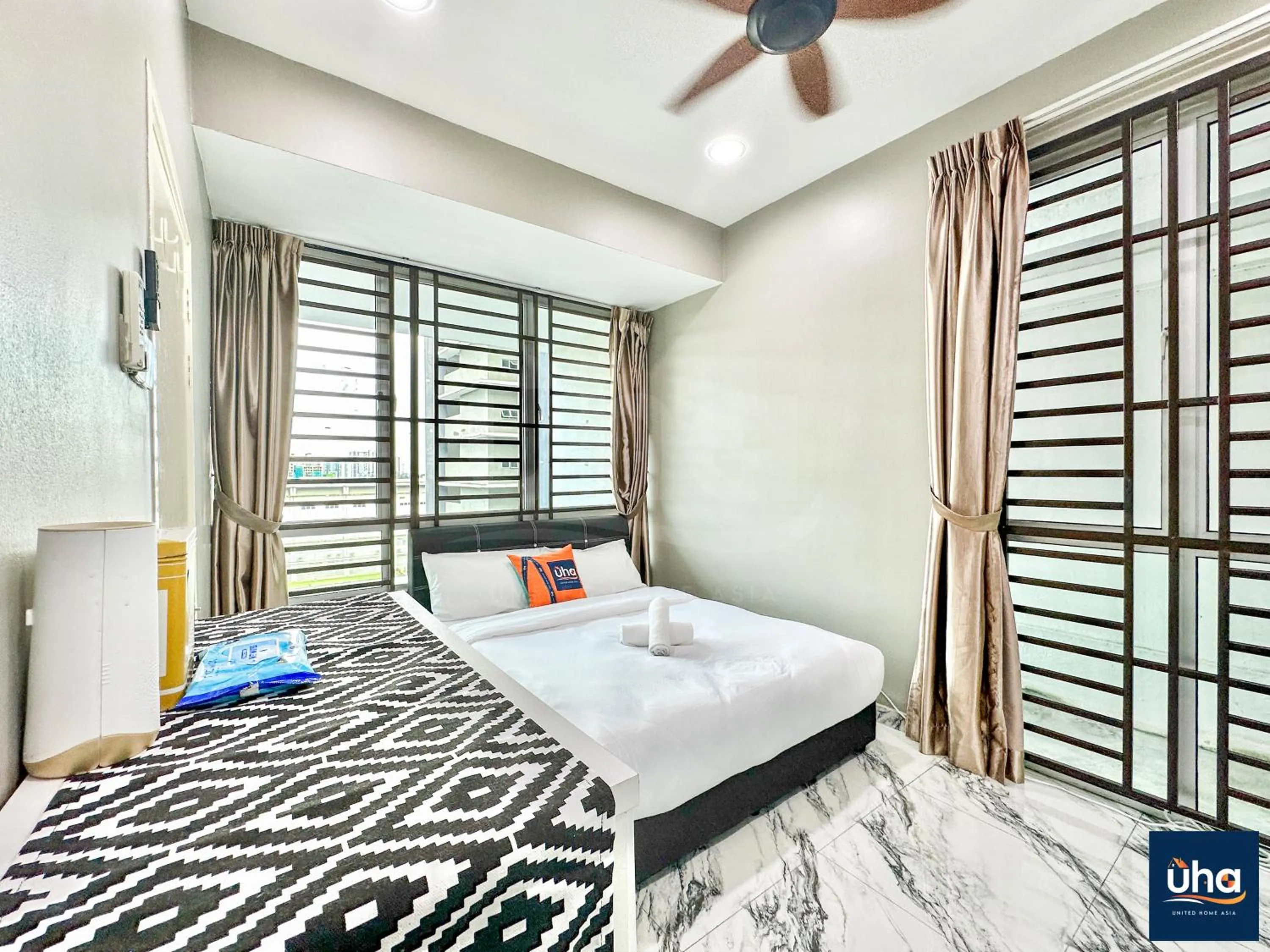 Bed in Akademik Suite by JK Home