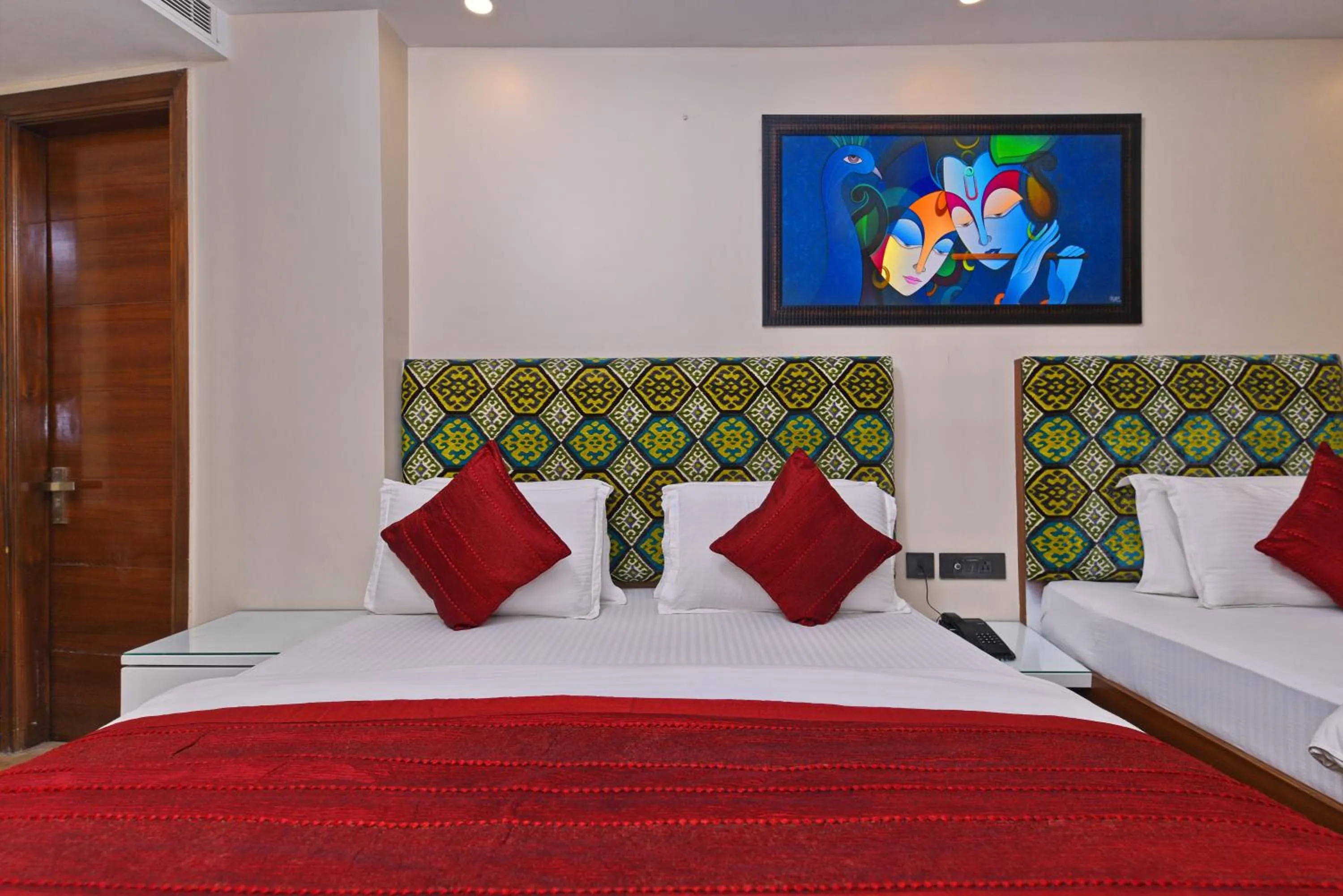 Bed in Staybook Hotel Nitya Maharani, Free Airport Pickup