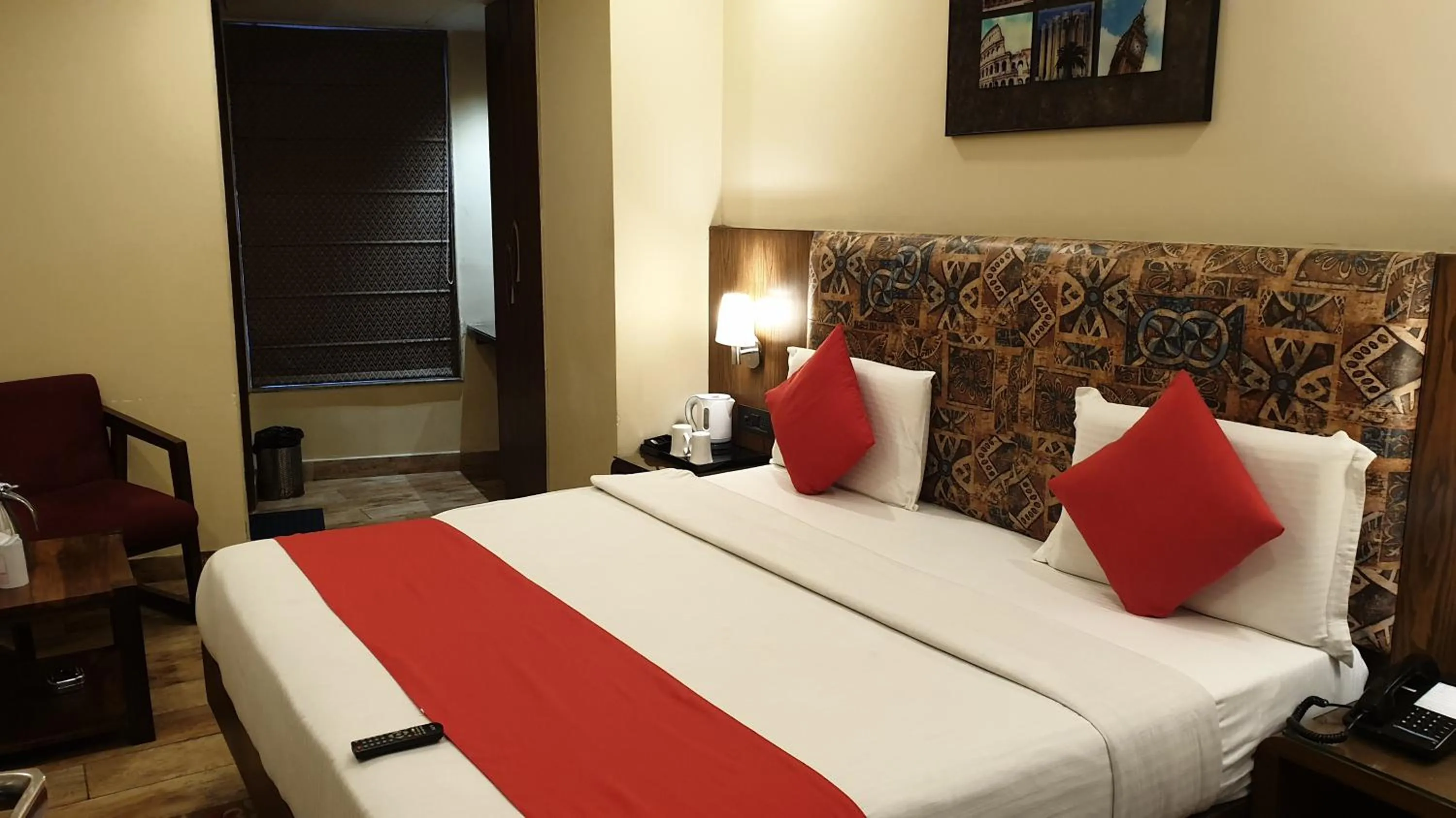 Bed in Staybook Hotel Nitya Maharani, Free Airport Pickup