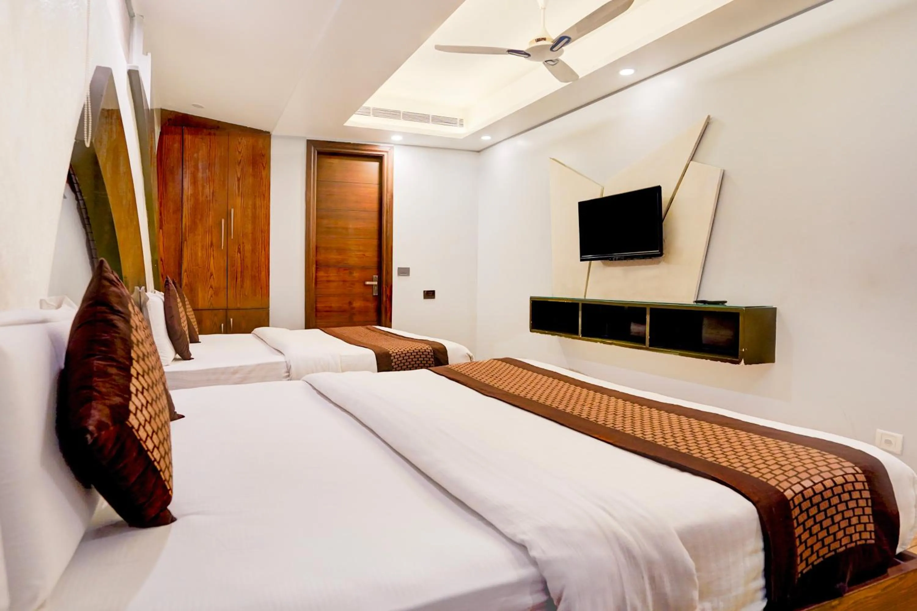 Bed in Staybook Hotel Nitya Maharani, Free Airport Pickup