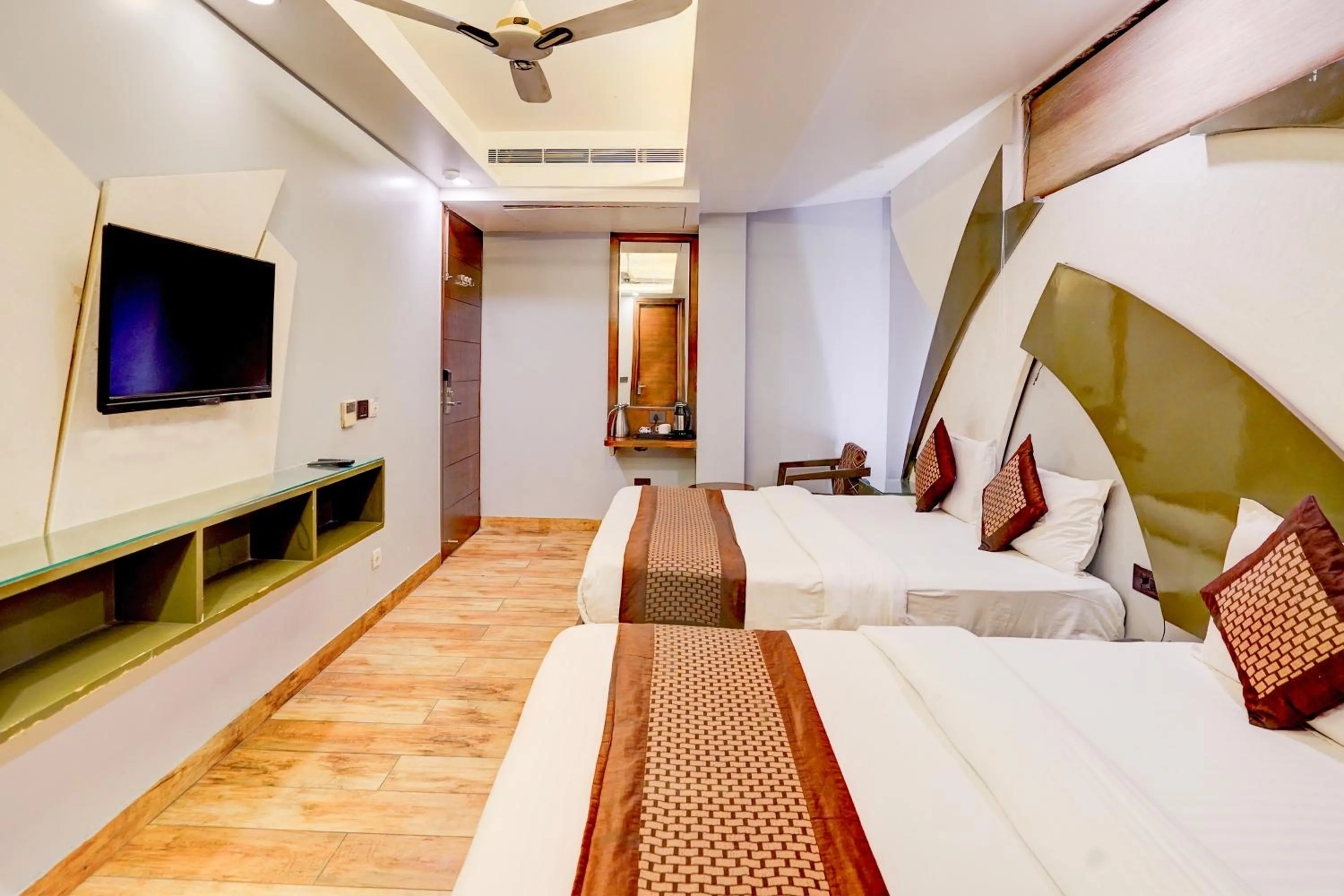 Bed in Staybook Hotel Nitya Maharani, Free Airport Pickup