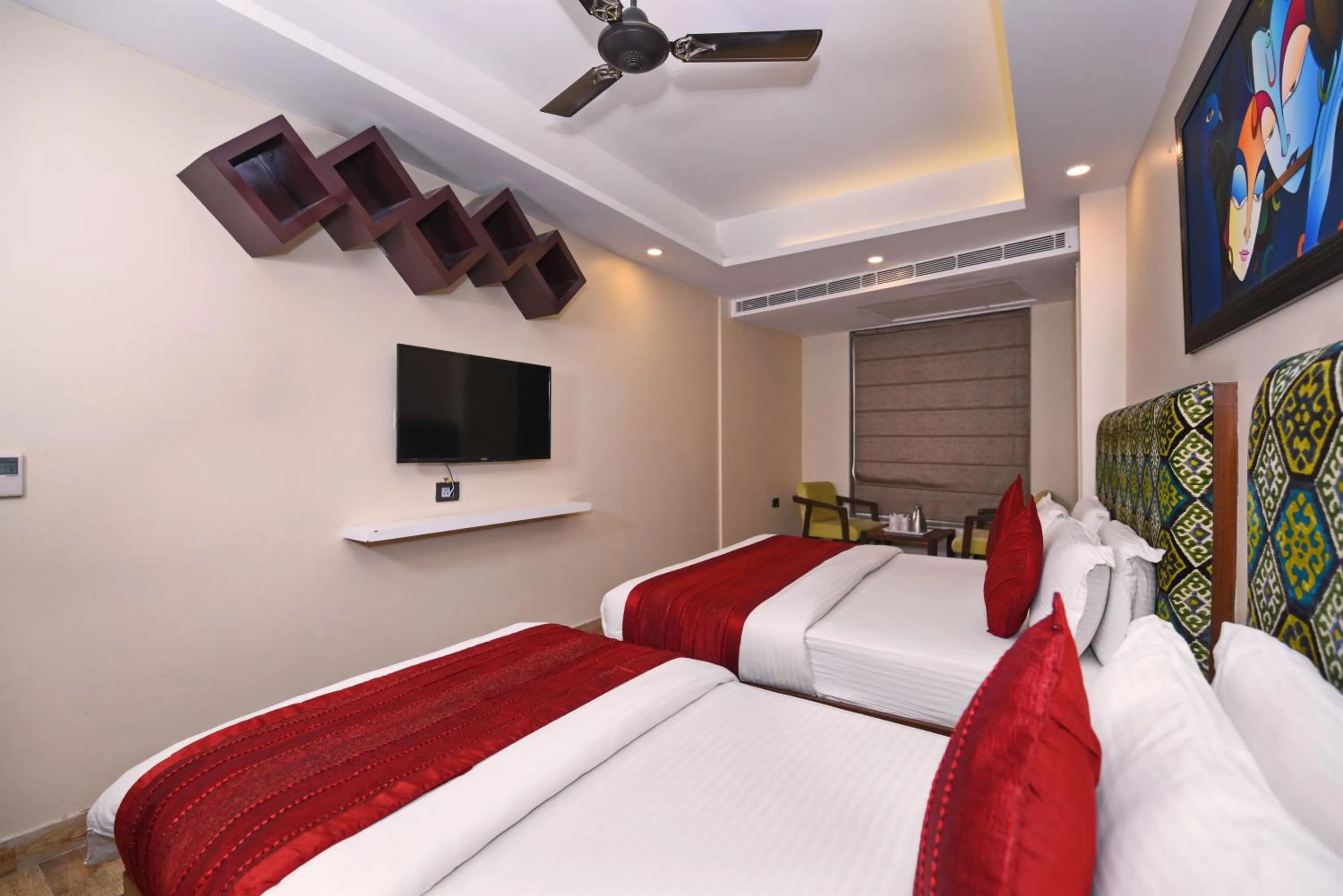 Communal lounge/ TV room, Bed in Staybook Hotel Nitya Maharani, Free Airport Pickup