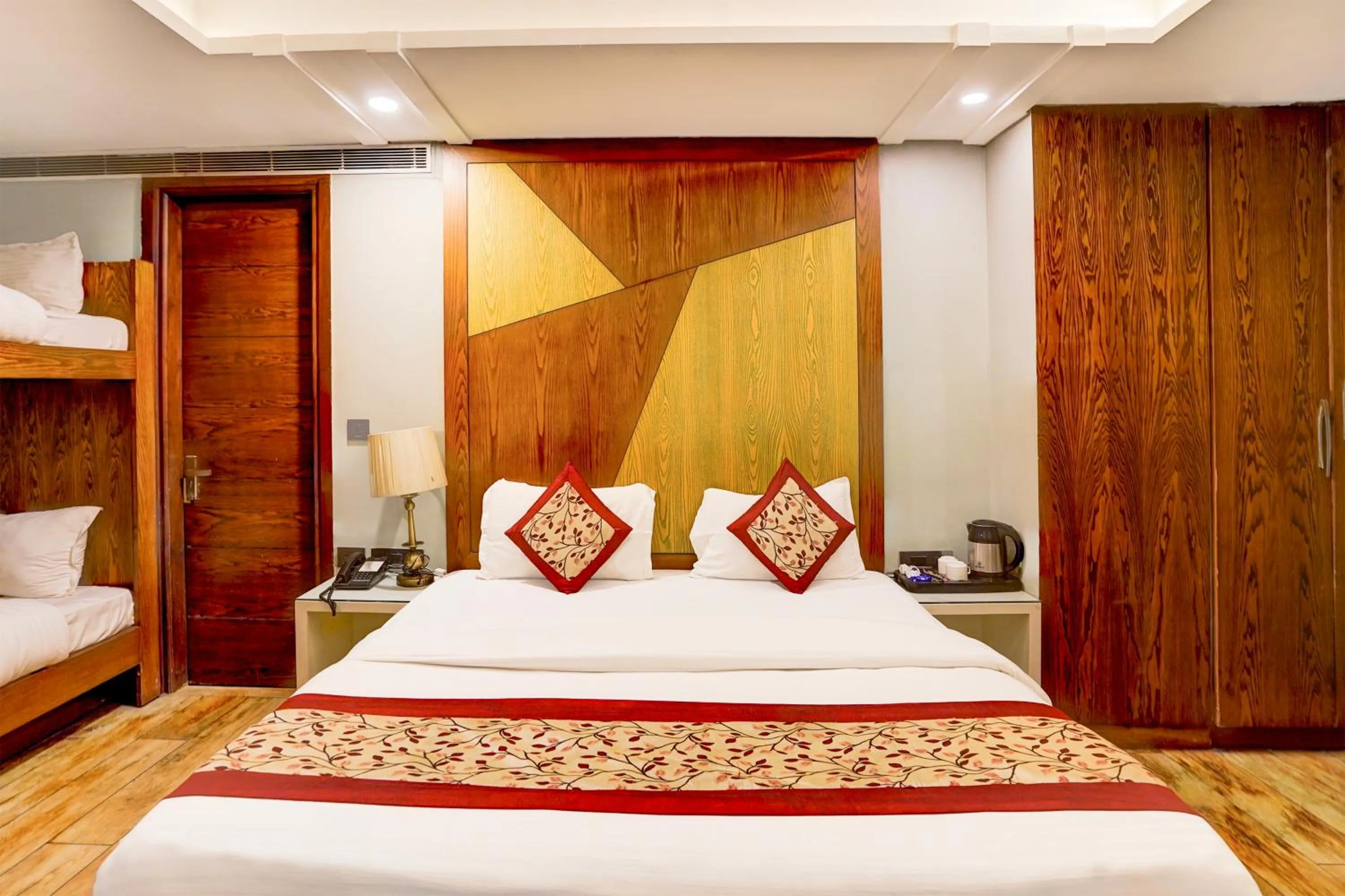 Bed in Staybook Hotel Nitya Maharani, Free Airport Pickup