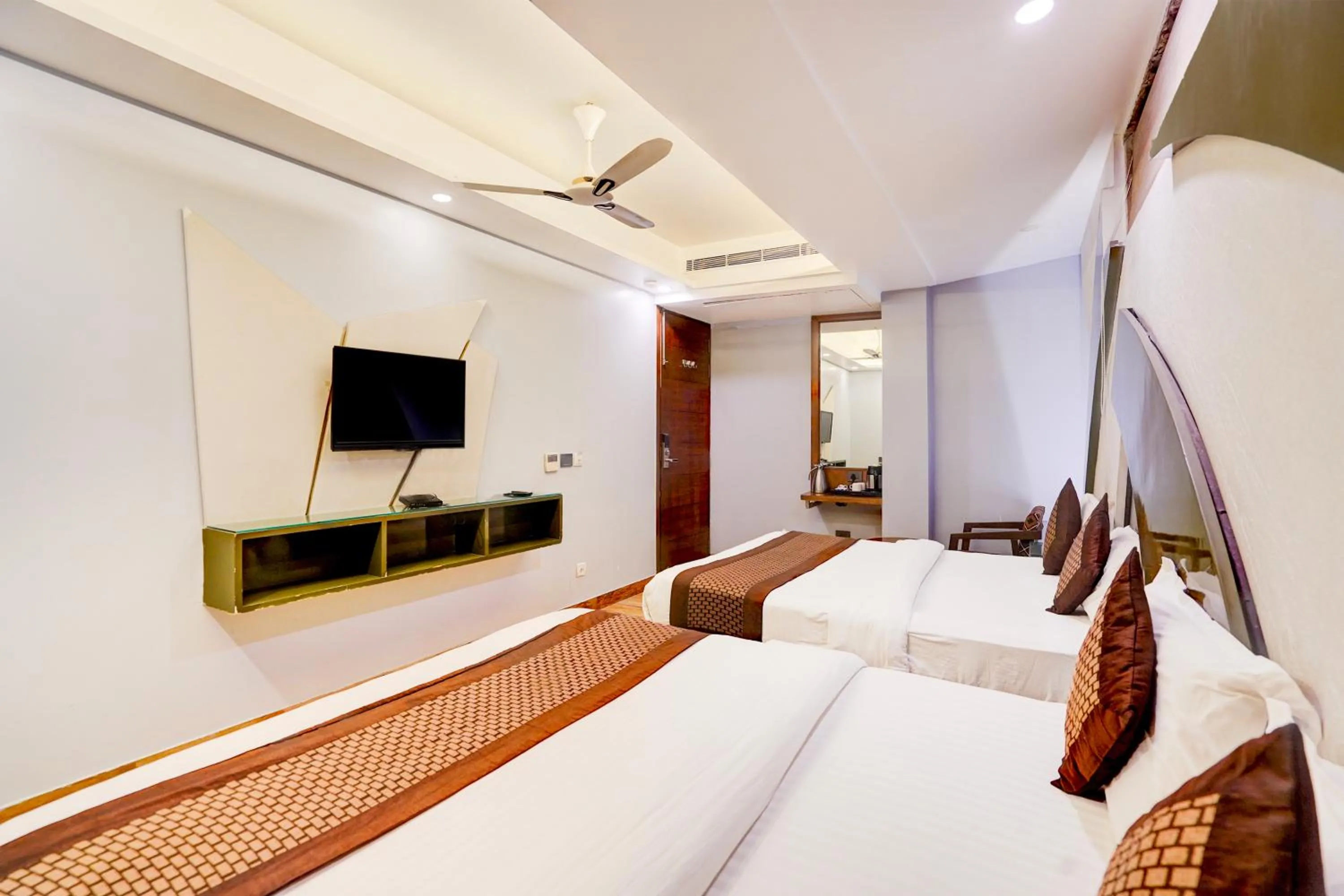 Bed in Staybook Hotel Nitya Maharani, Free Airport Pickup