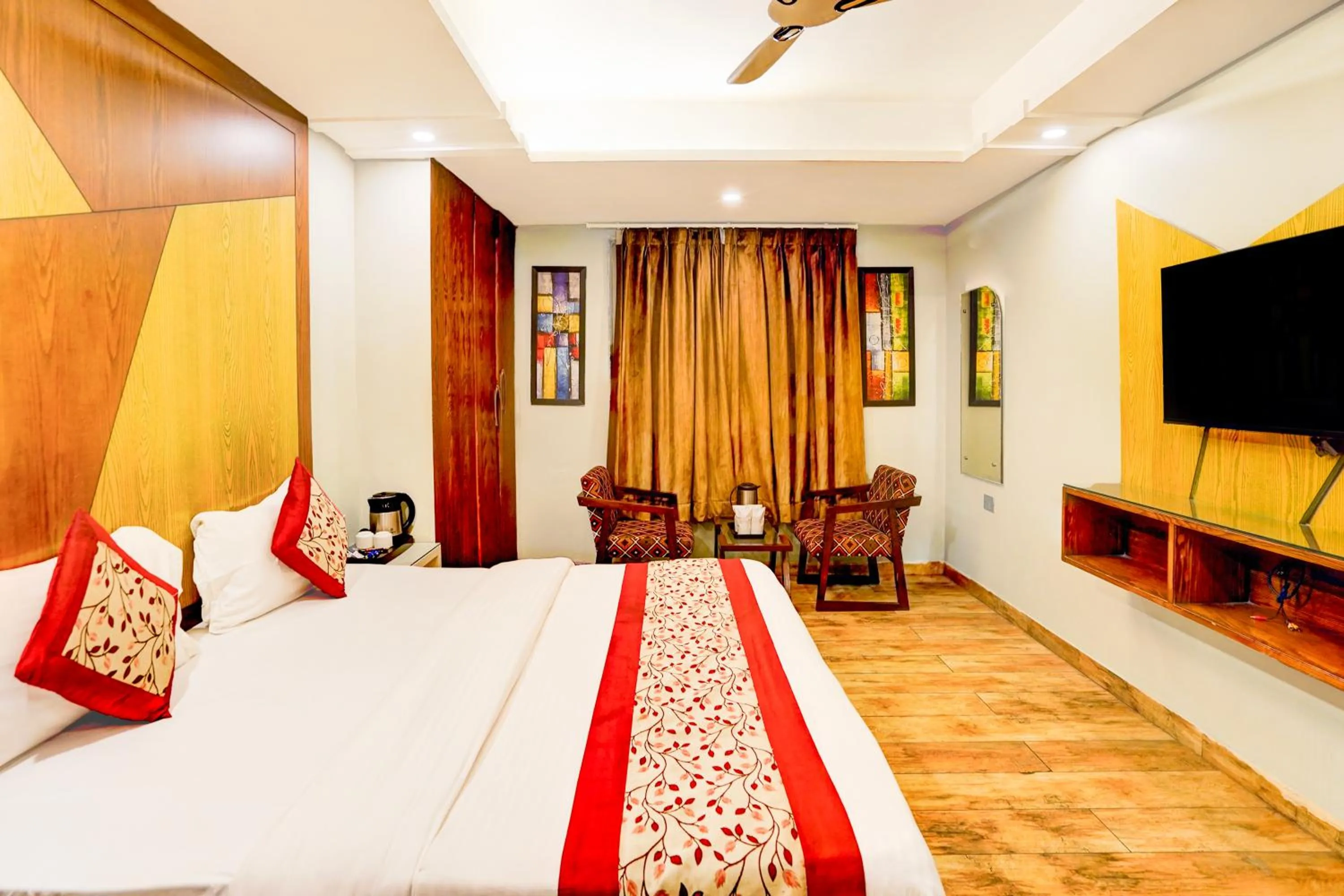 TV and multimedia, Bed in Staybook Hotel Nitya Maharani, Free Airport Pickup
