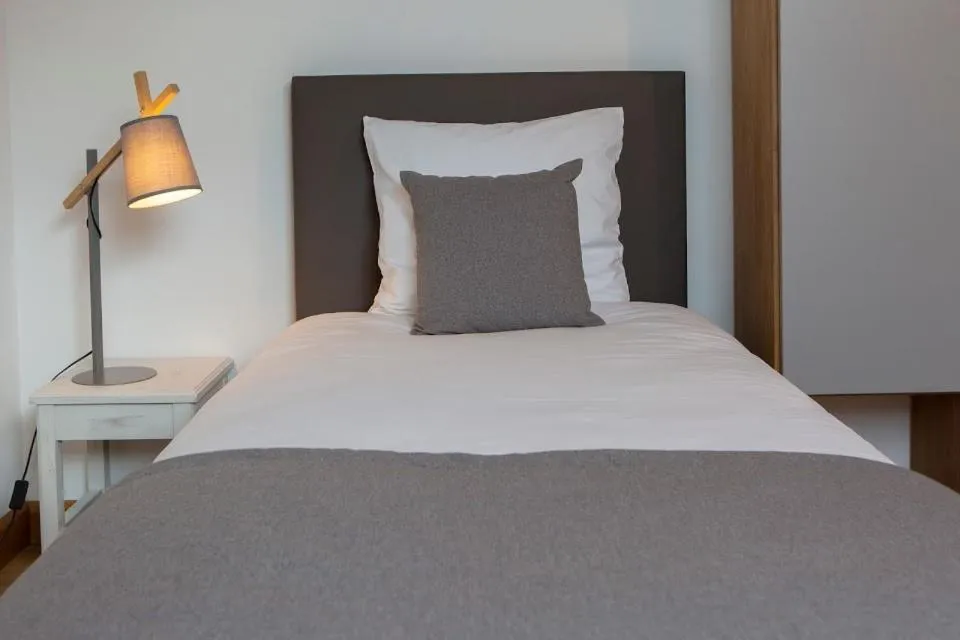 Bed in Gîtes de l'Orée du Bois - Boussières