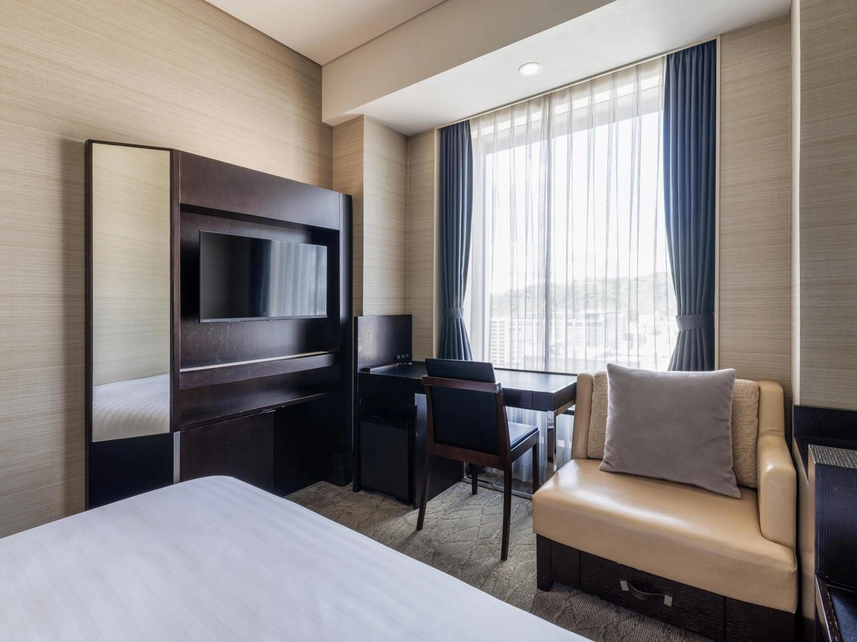 Photo of the whole room, Bed in Solaria Nishitetsu Hotel Kagoshima