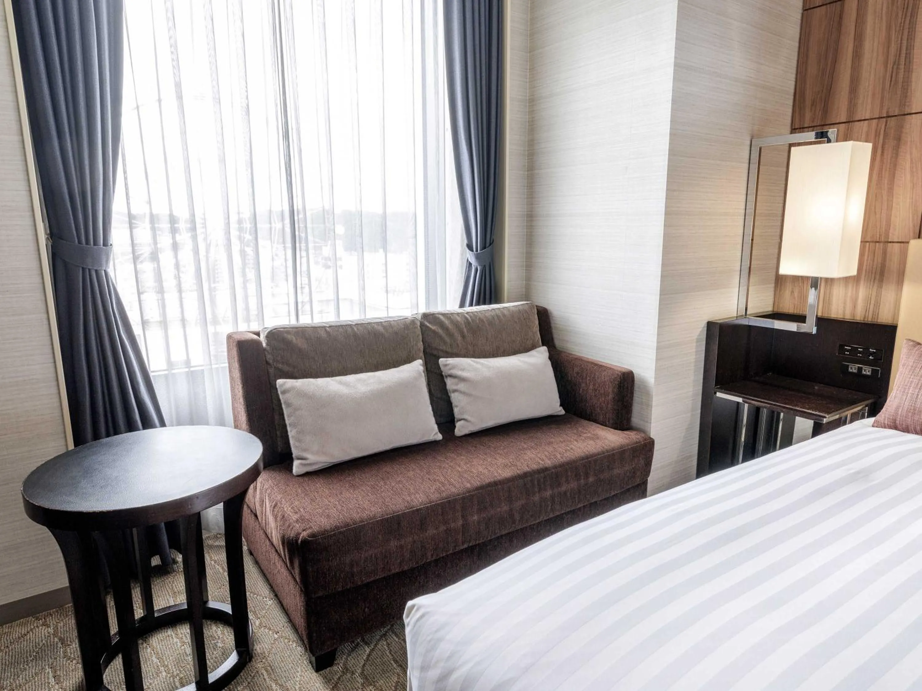 Photo of the whole room, Bed in Solaria Nishitetsu Hotel Kagoshima