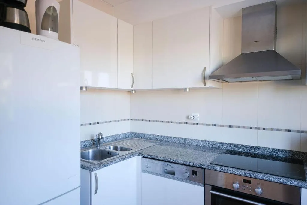 Kitchen or kitchenette in Aldeamento Turistico da Prainha