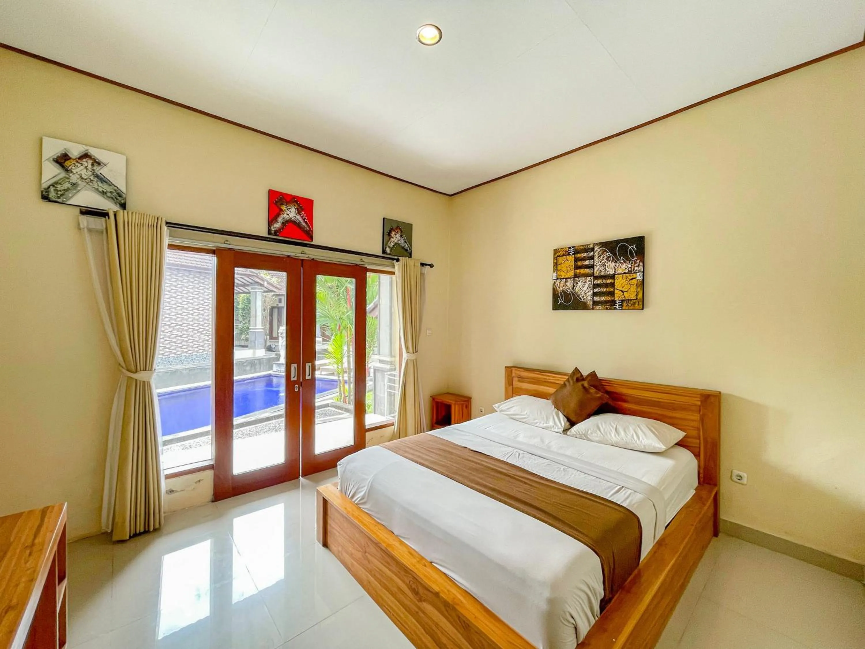 Bedroom, Bed in Urbanview Hotel Lilis Cempaka Mas Guesthouse