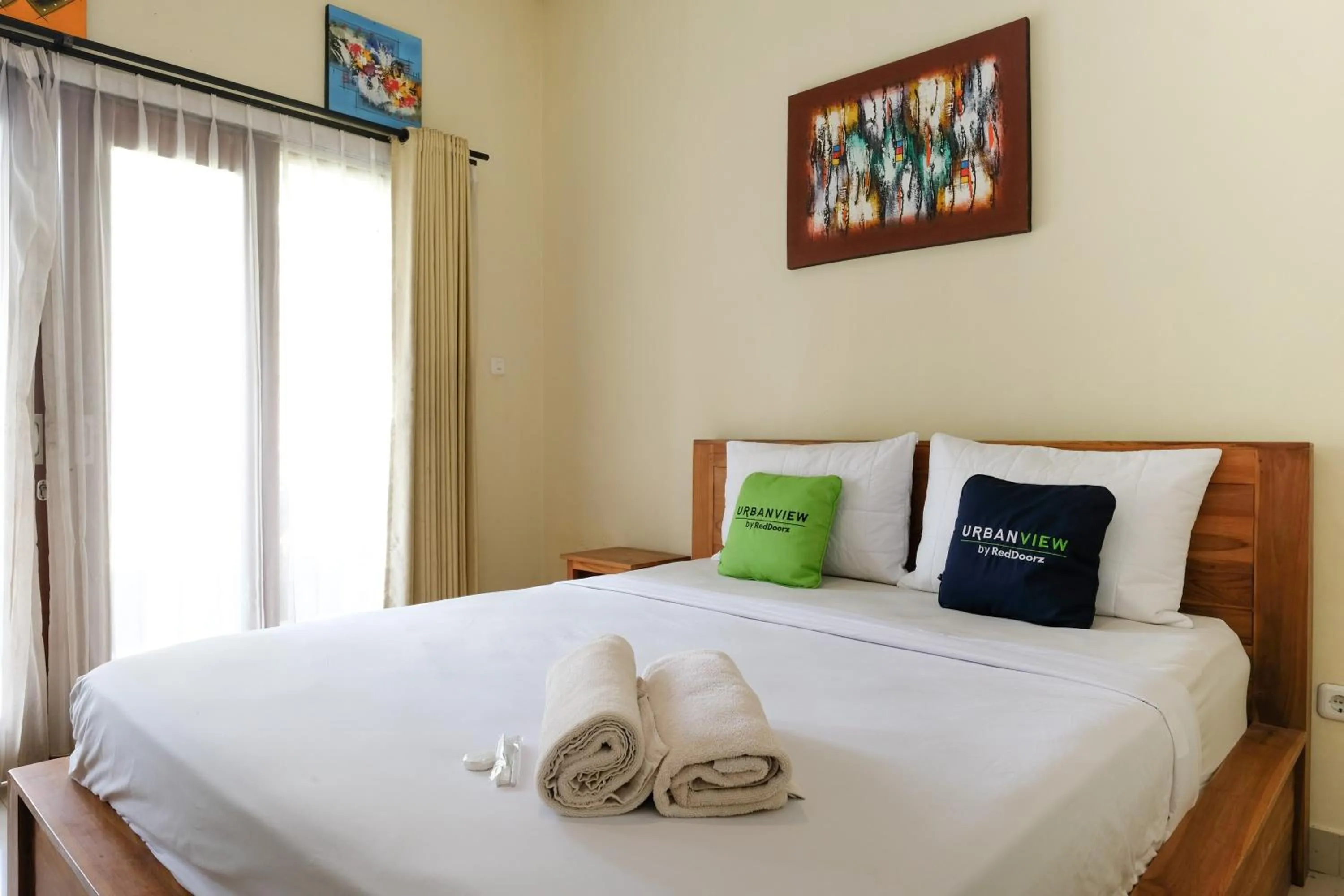 Bed in Urbanview Hotel Lilis Cempaka Mas Guesthouse