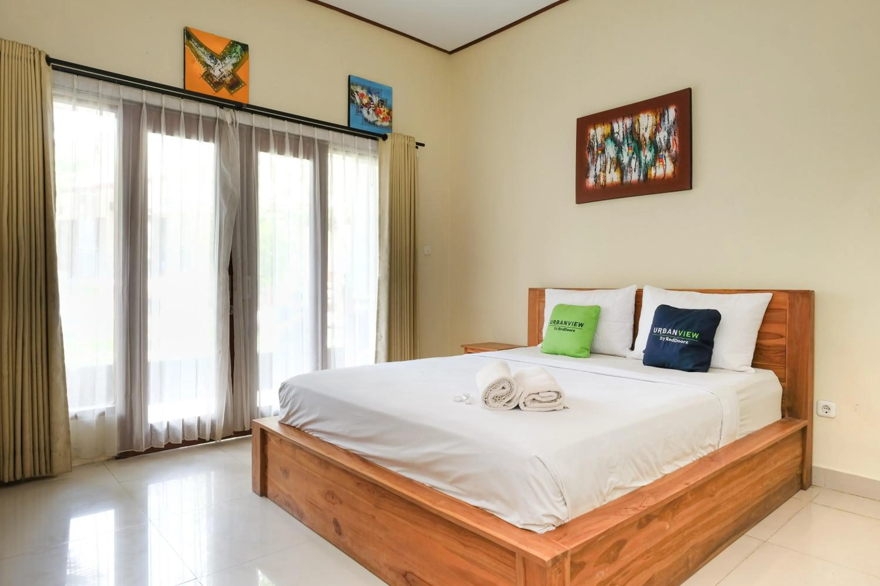 Bed in Urbanview Hotel Lilis Cempaka Mas Guesthouse