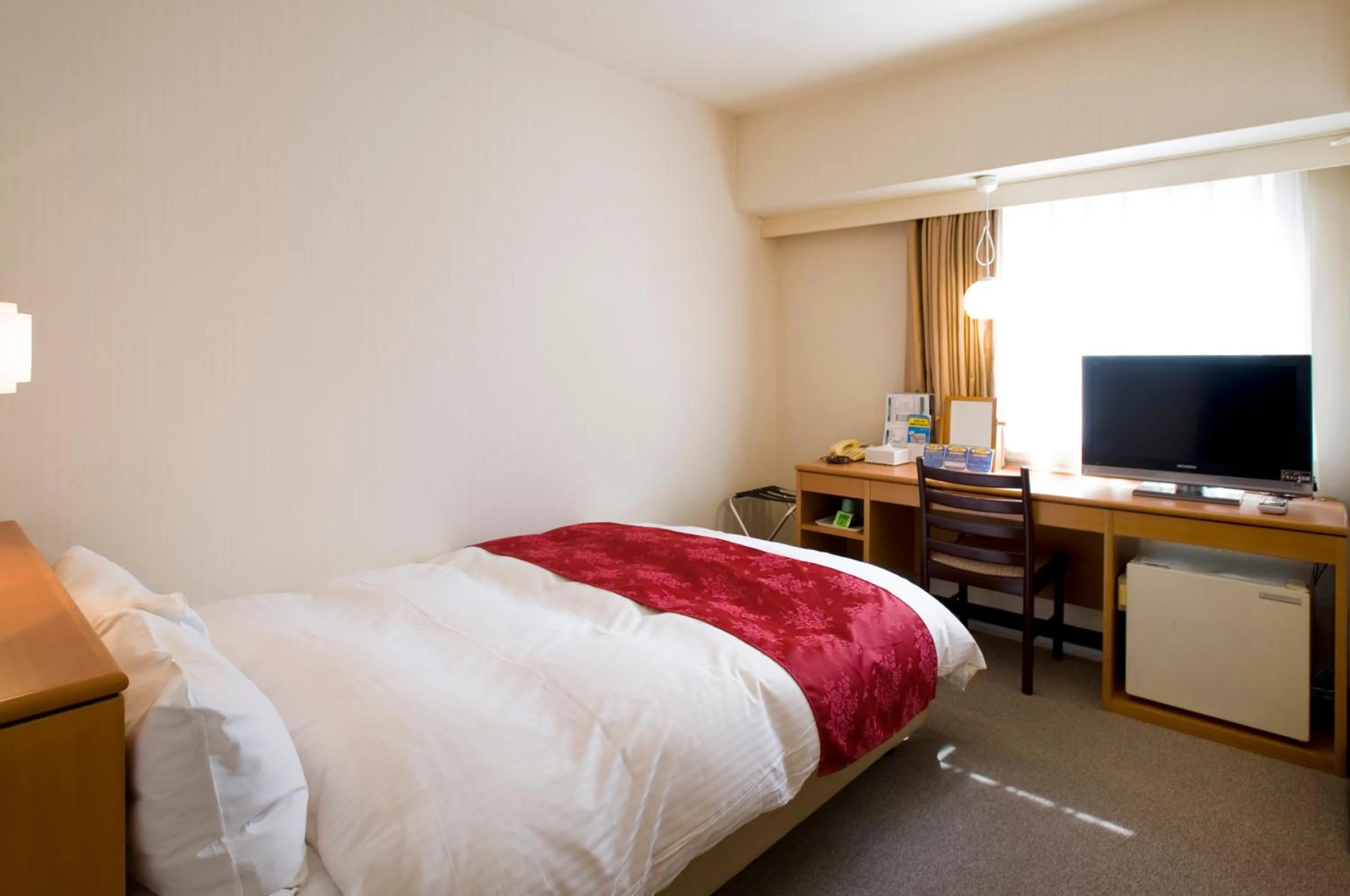 Bed in Hotel Taisei Annex