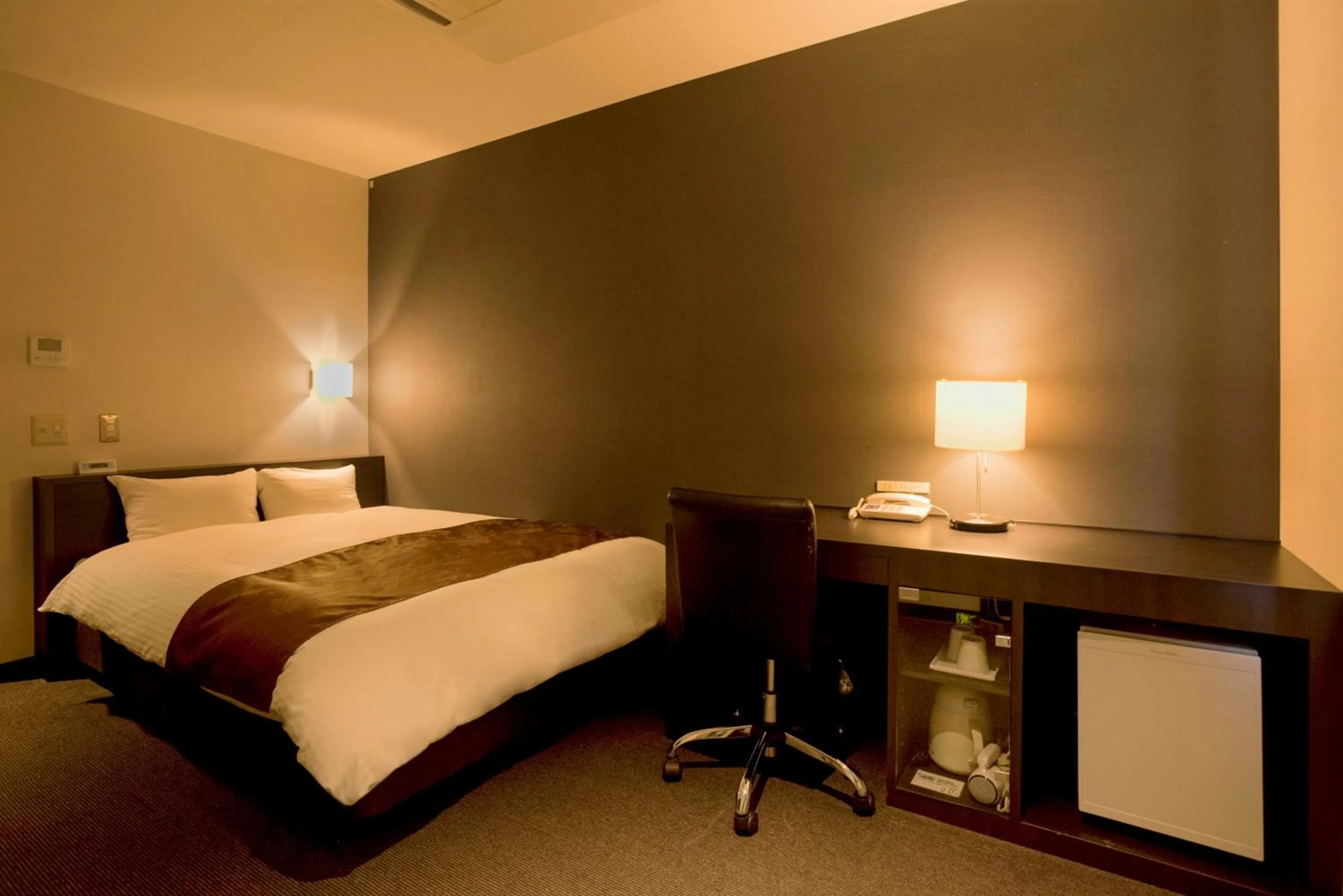 Bed in Hotel Taisei Annex