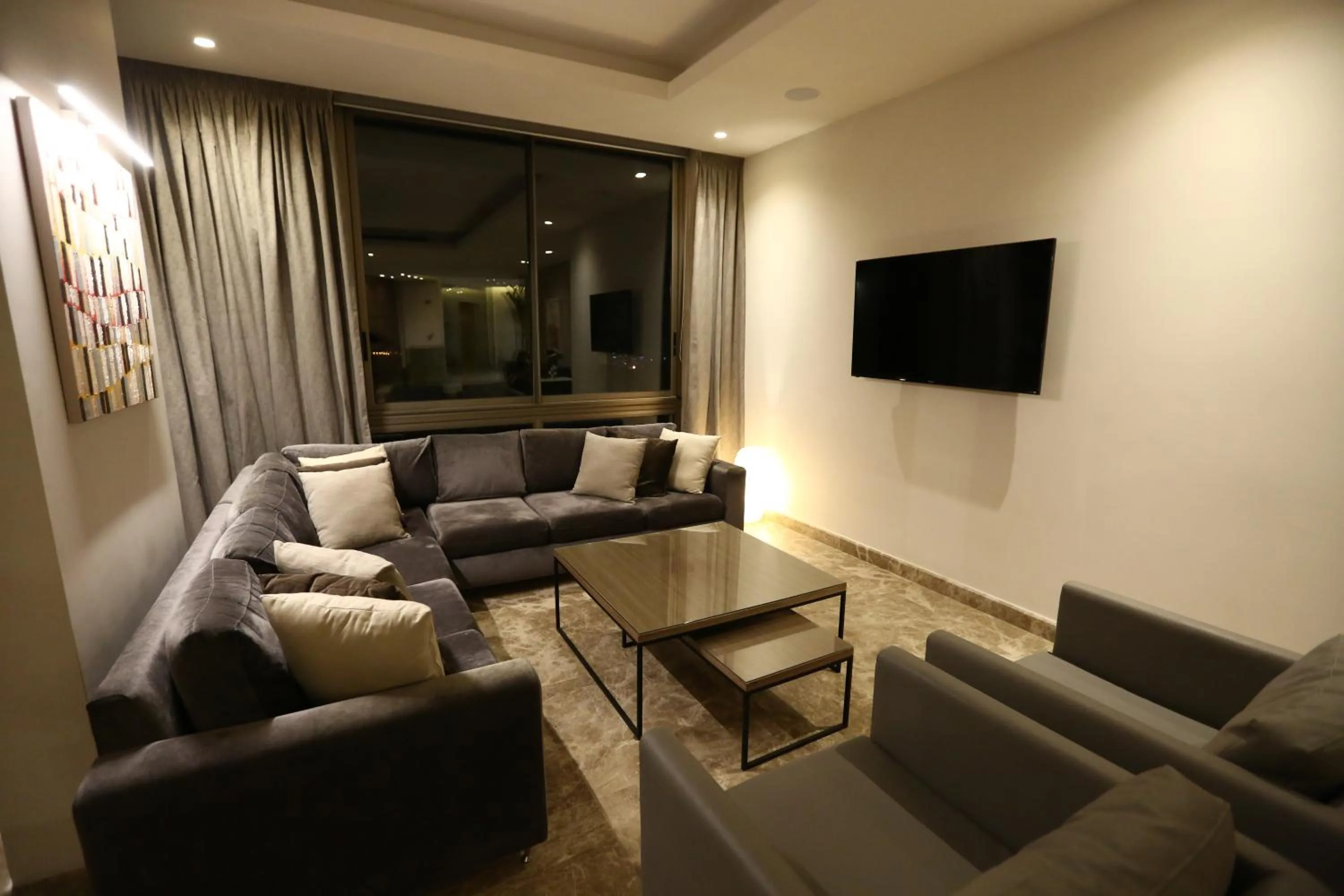 Communal lounge/ TV room in The Ray Hotel and Studios