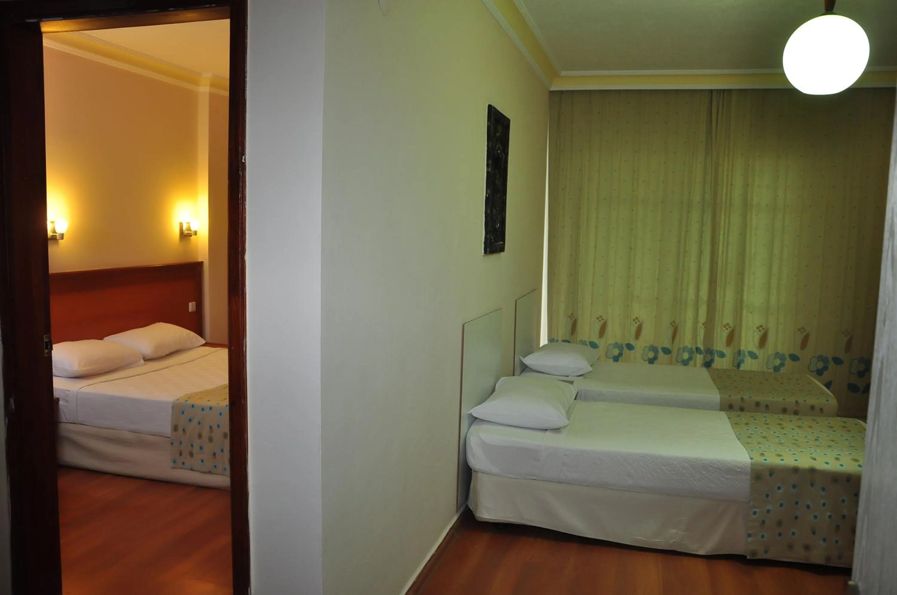 Bed in Cinar Family Suite Hotel
