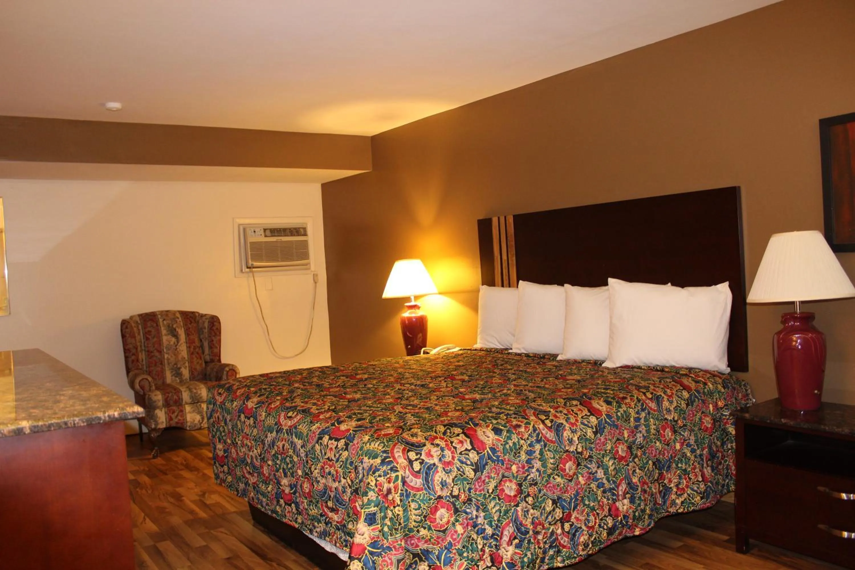 Bed in American Inn and Suites