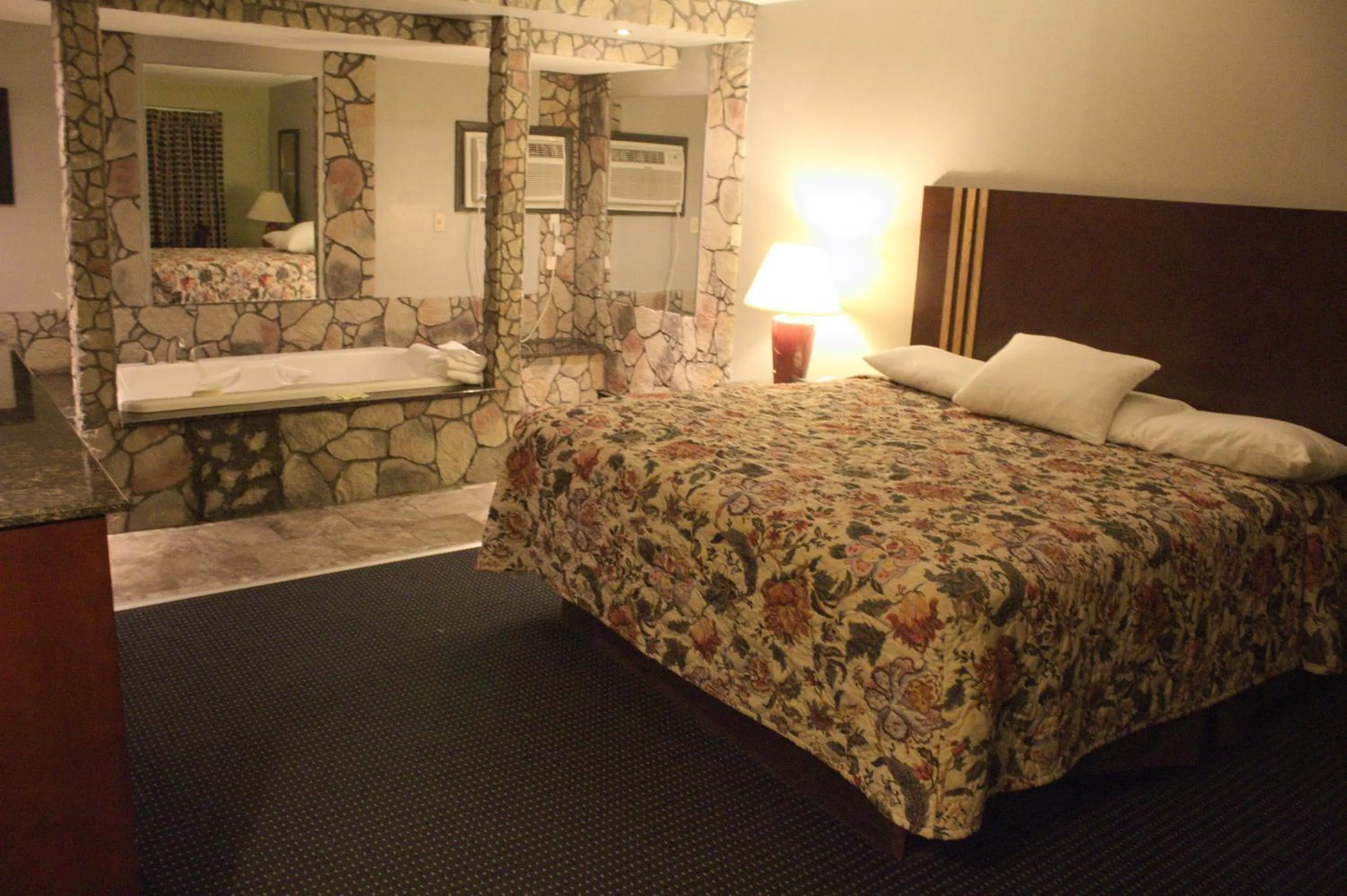 Bed in American Inn and Suites