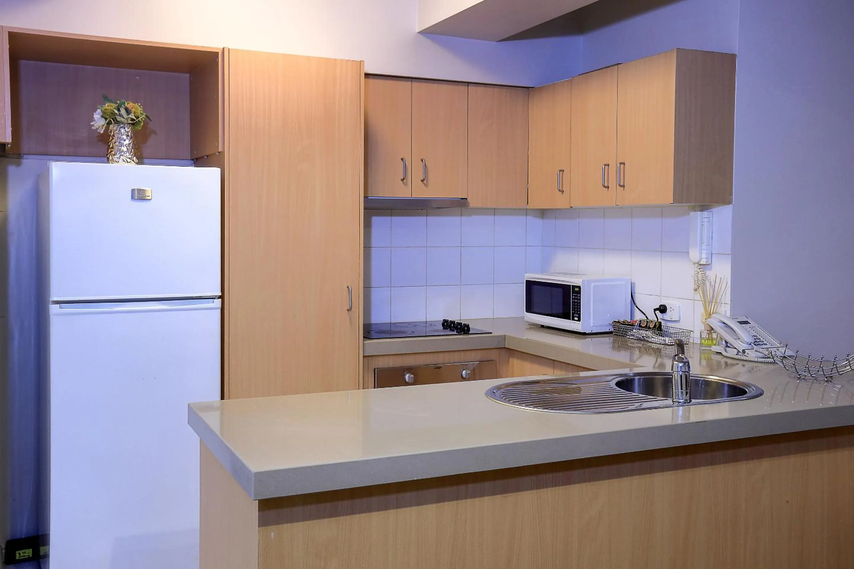 Kitchen or kitchenette in Flinders Landing Apartments