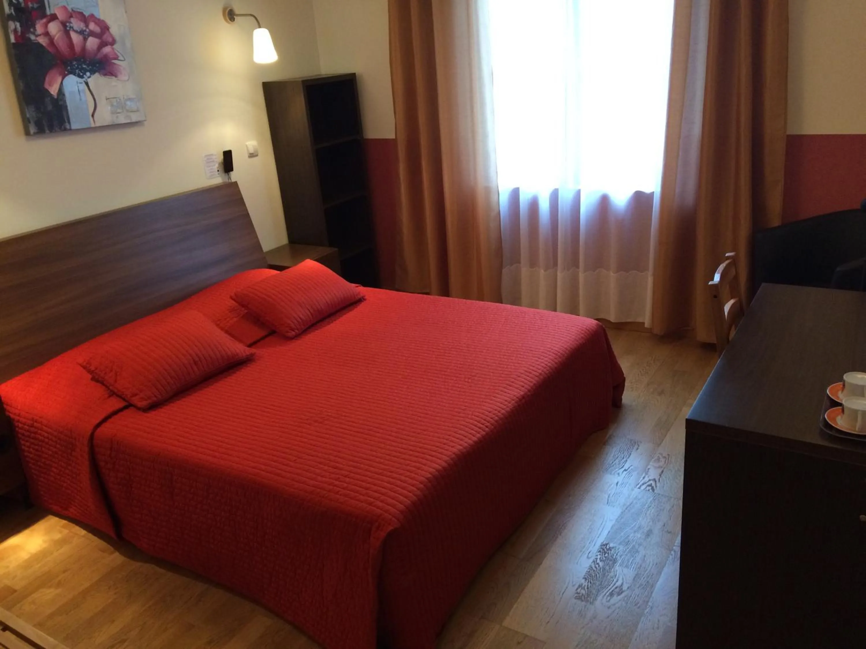 Bed in LOGIS Hôtel Le Chantoiseau