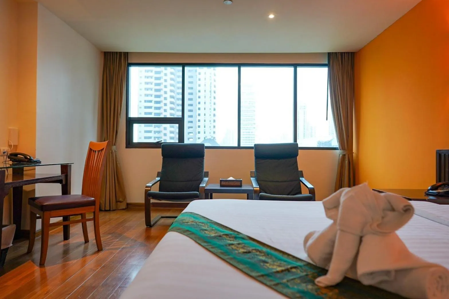 Bed in Hotel Mermaid Bangkok