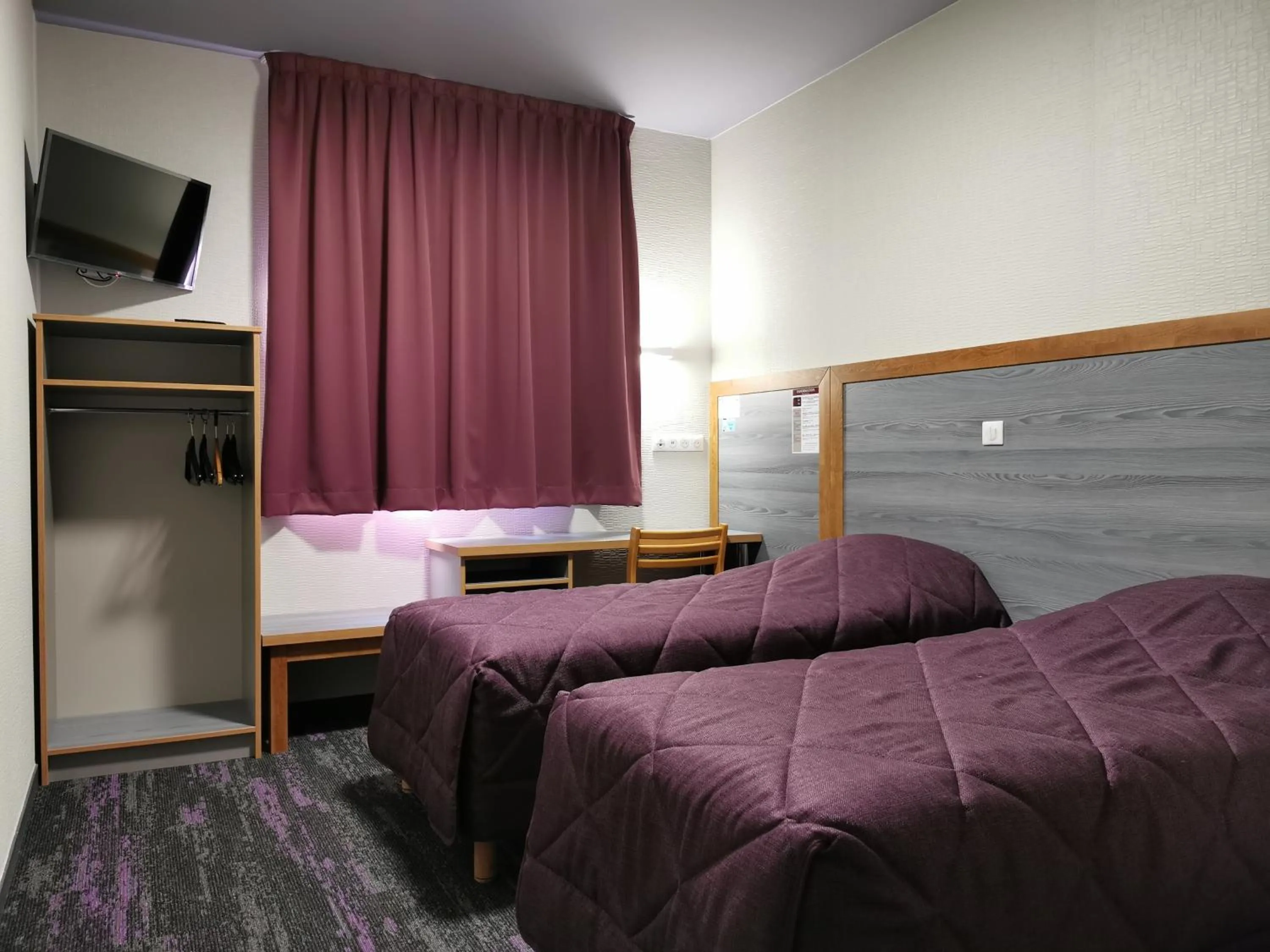 Bed in Hôtel Siatel Besançon Chateaufarine