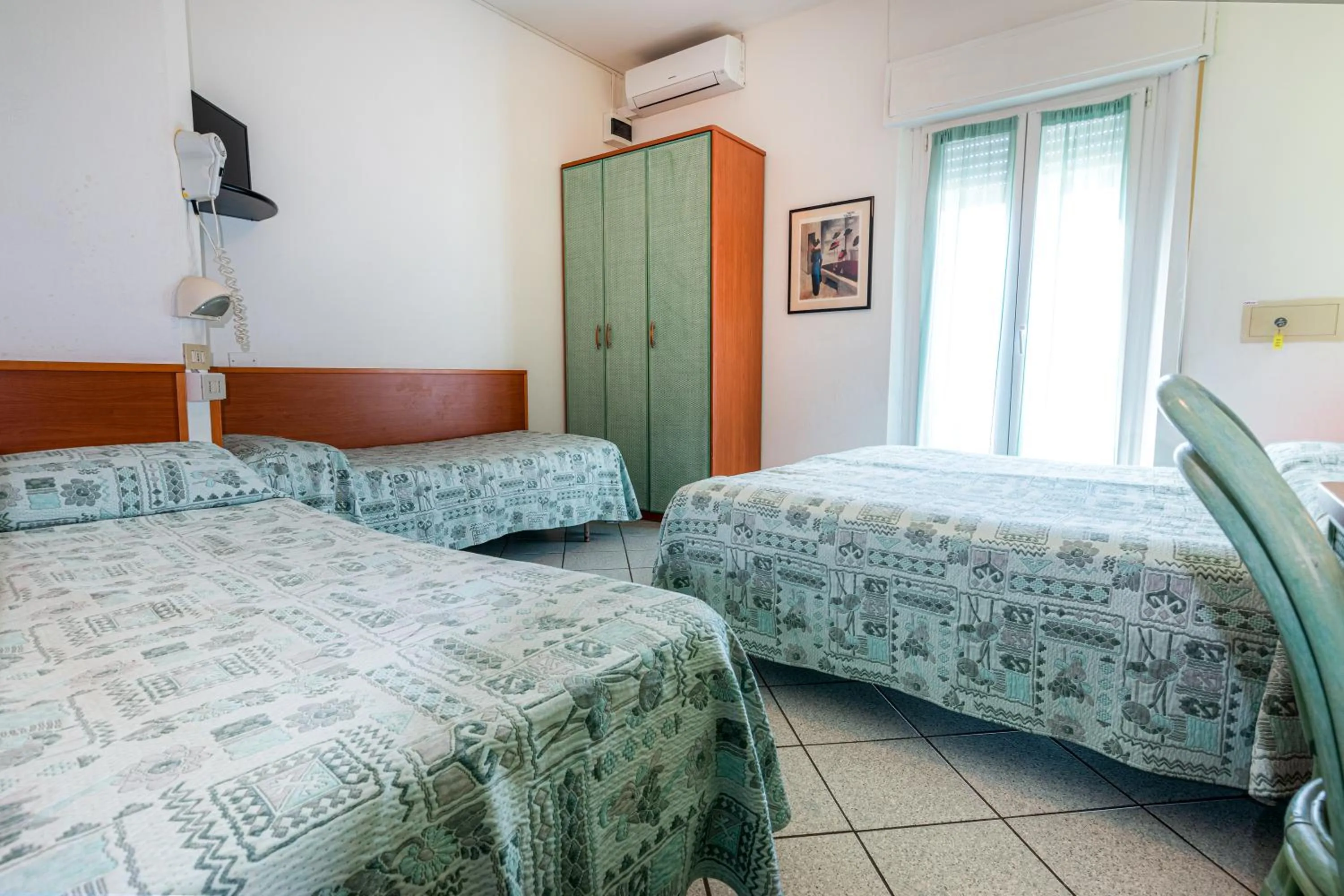 Bed in Hotel Diamond