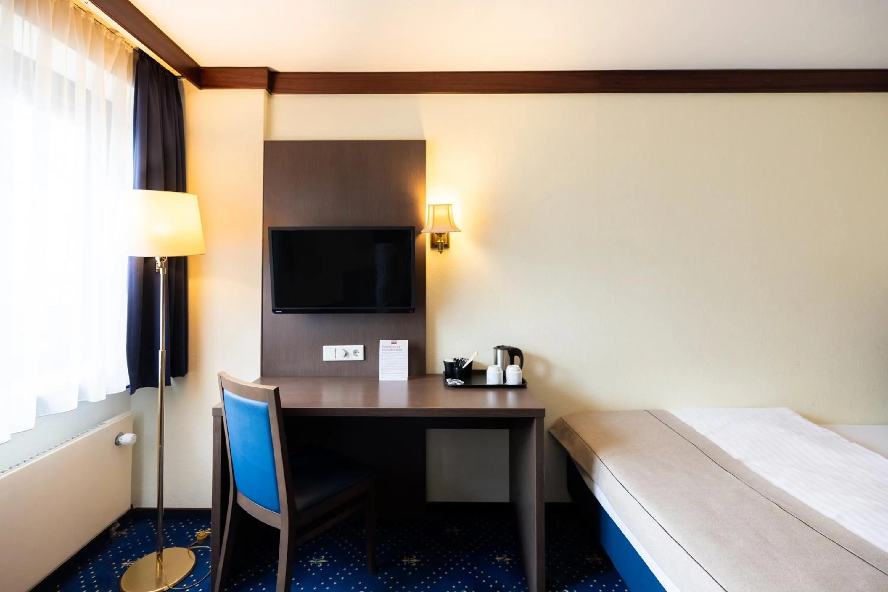 Bed in Novum Hotel Imperial Frankfurt Messe