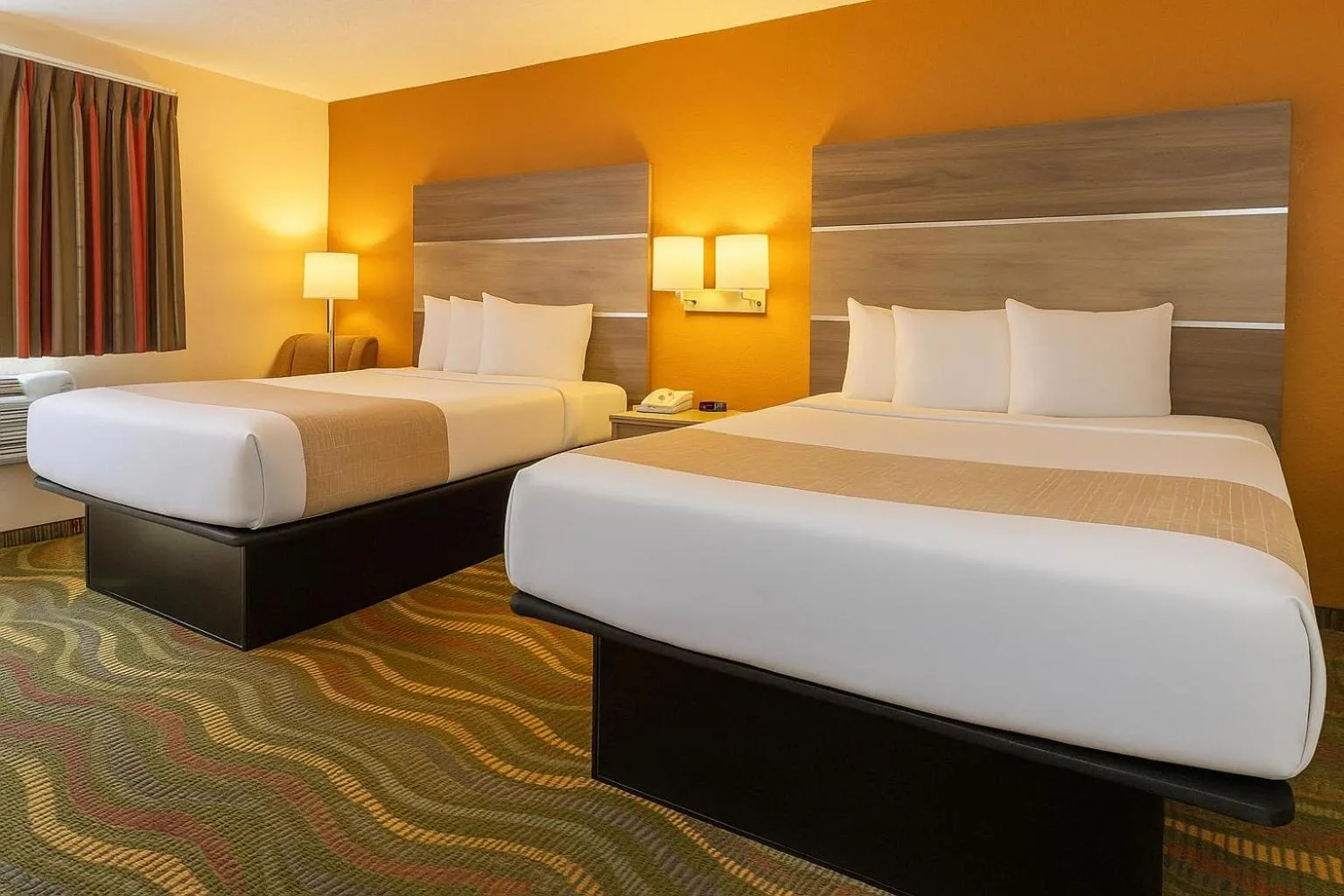 Bed in Travelodge by Wyndham Muskegon