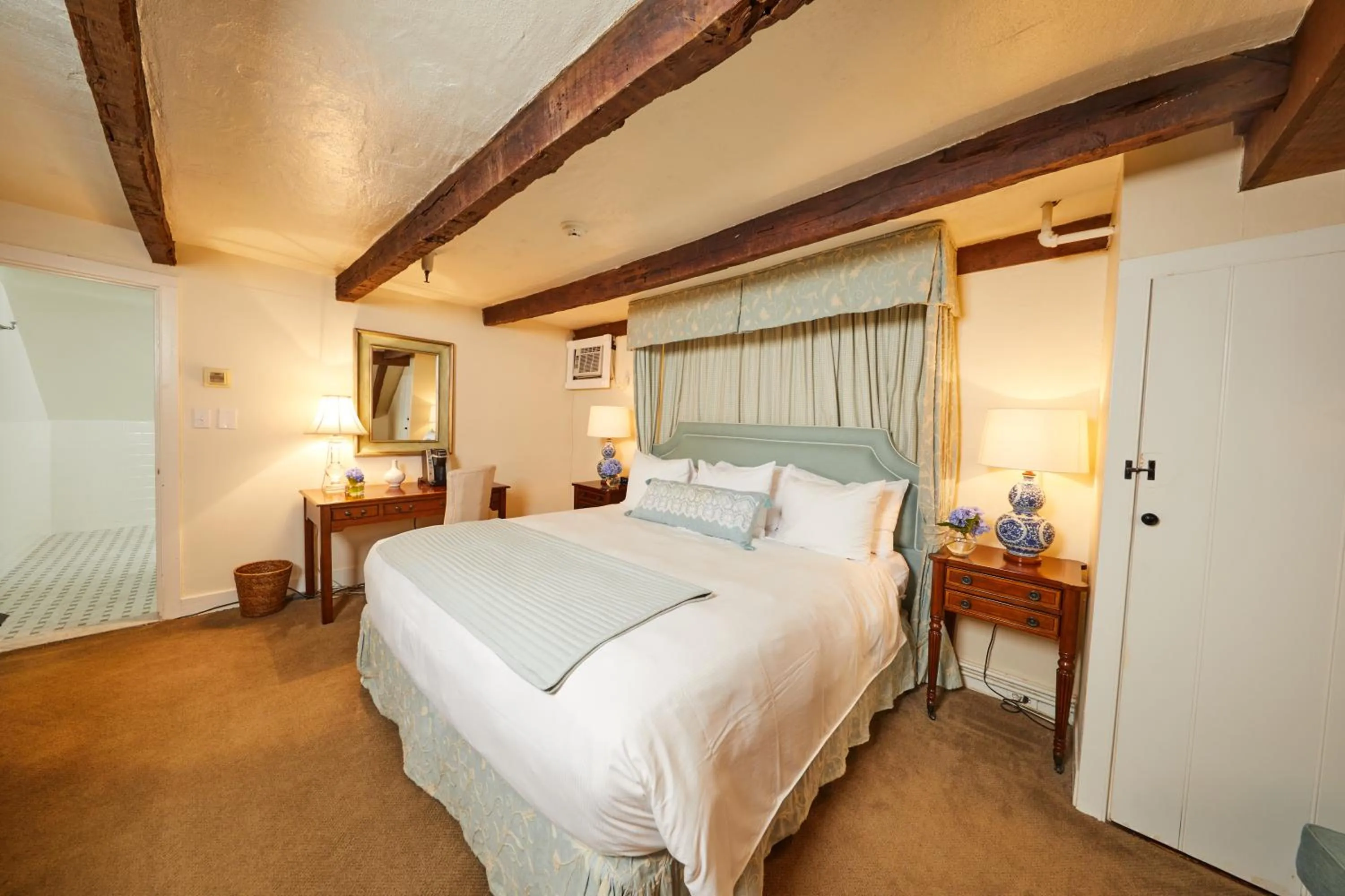 Bed in Three Village Inn