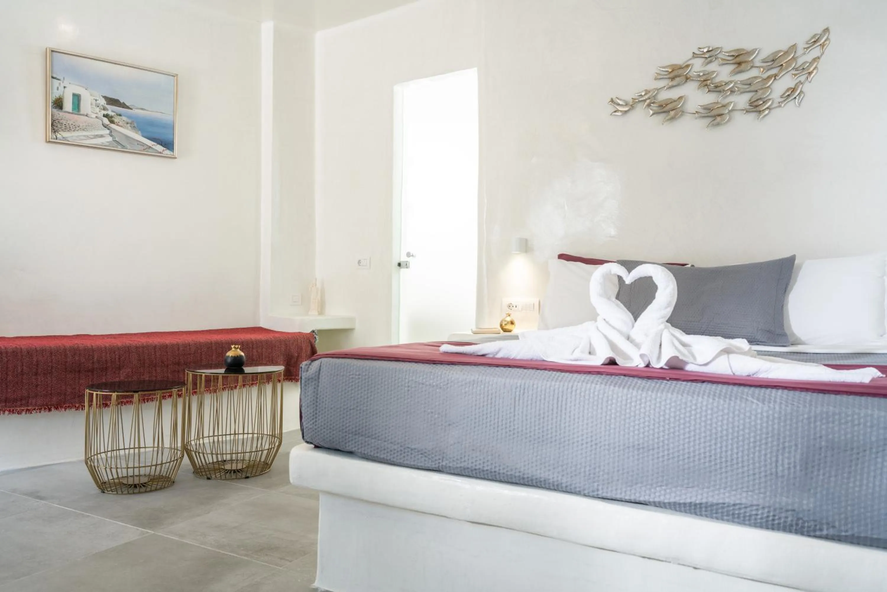 Living room, Bed in The Muses of Santorini Private Jacuzzi Suites